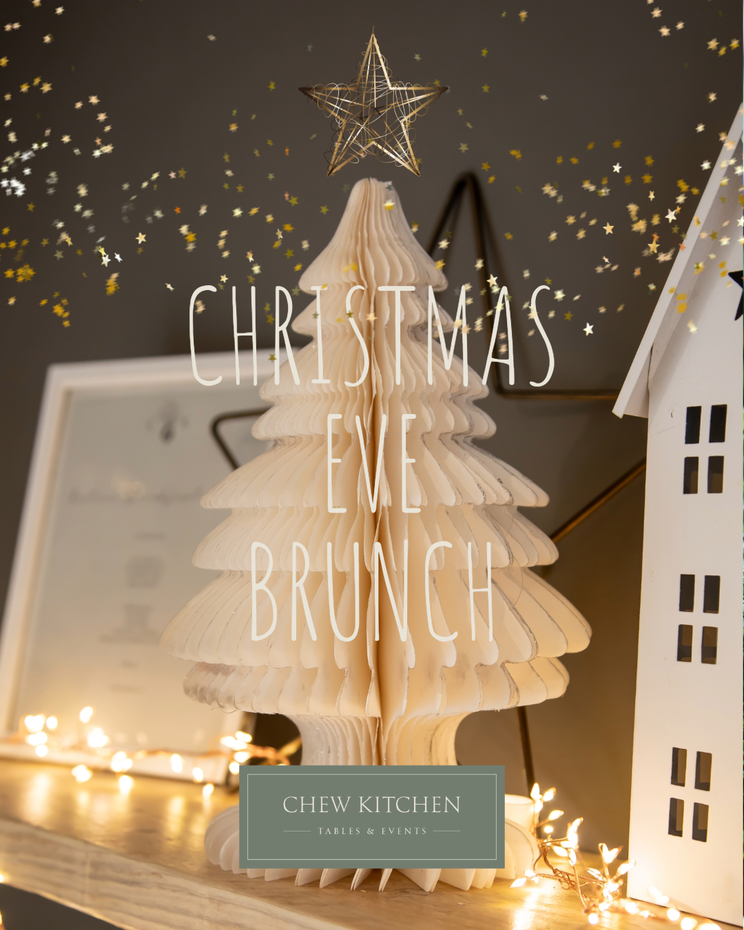 White paper christmas tree on shelf lit with fairy lights