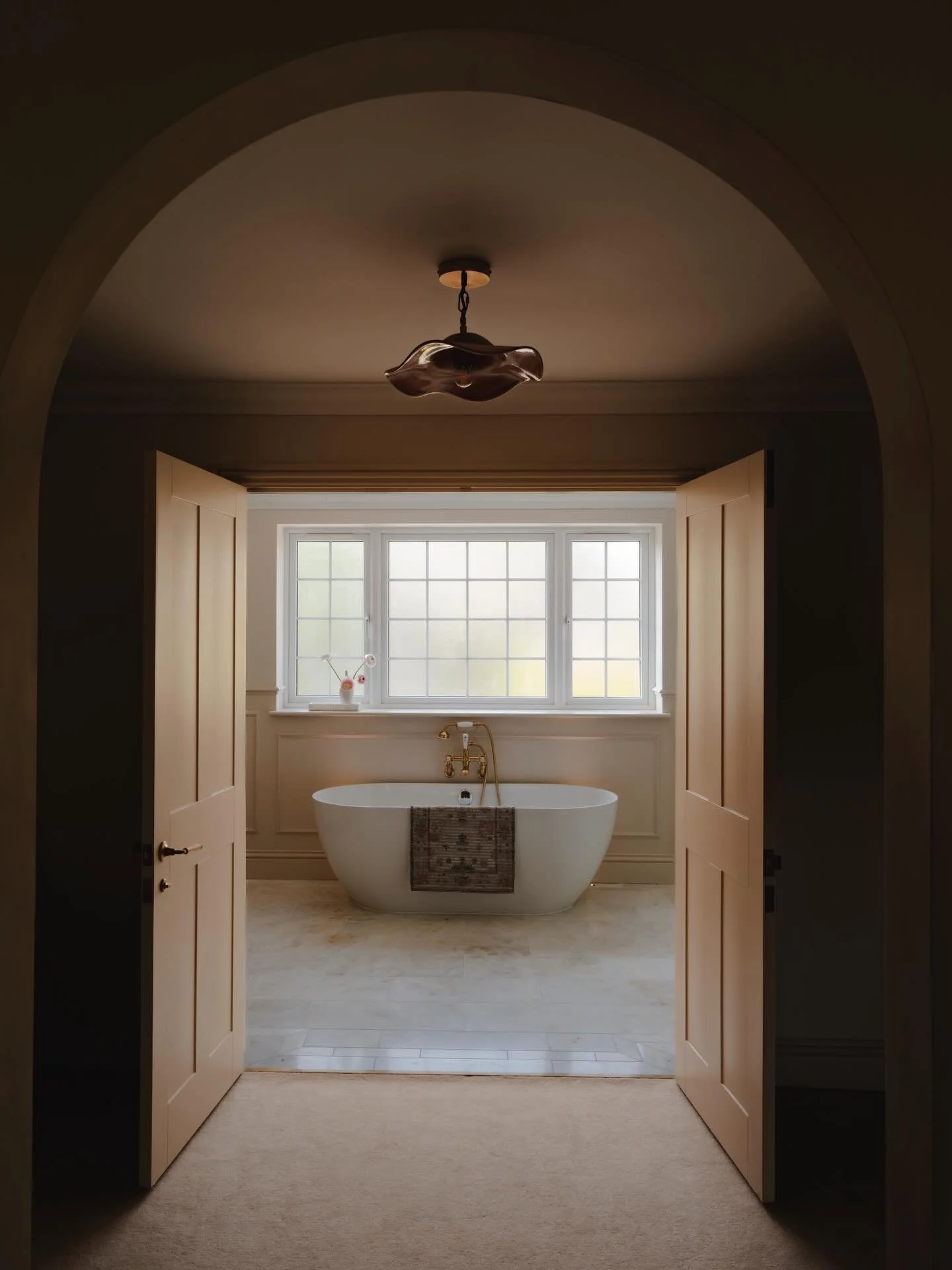 How&rsquo;s this for the view from the principal bedroom, through the dressing room, to the ensuite?

The arch &mdash; while a statement feature throughout the home &mdash; feels particularly perfect here. It softens the transition between spaces whi