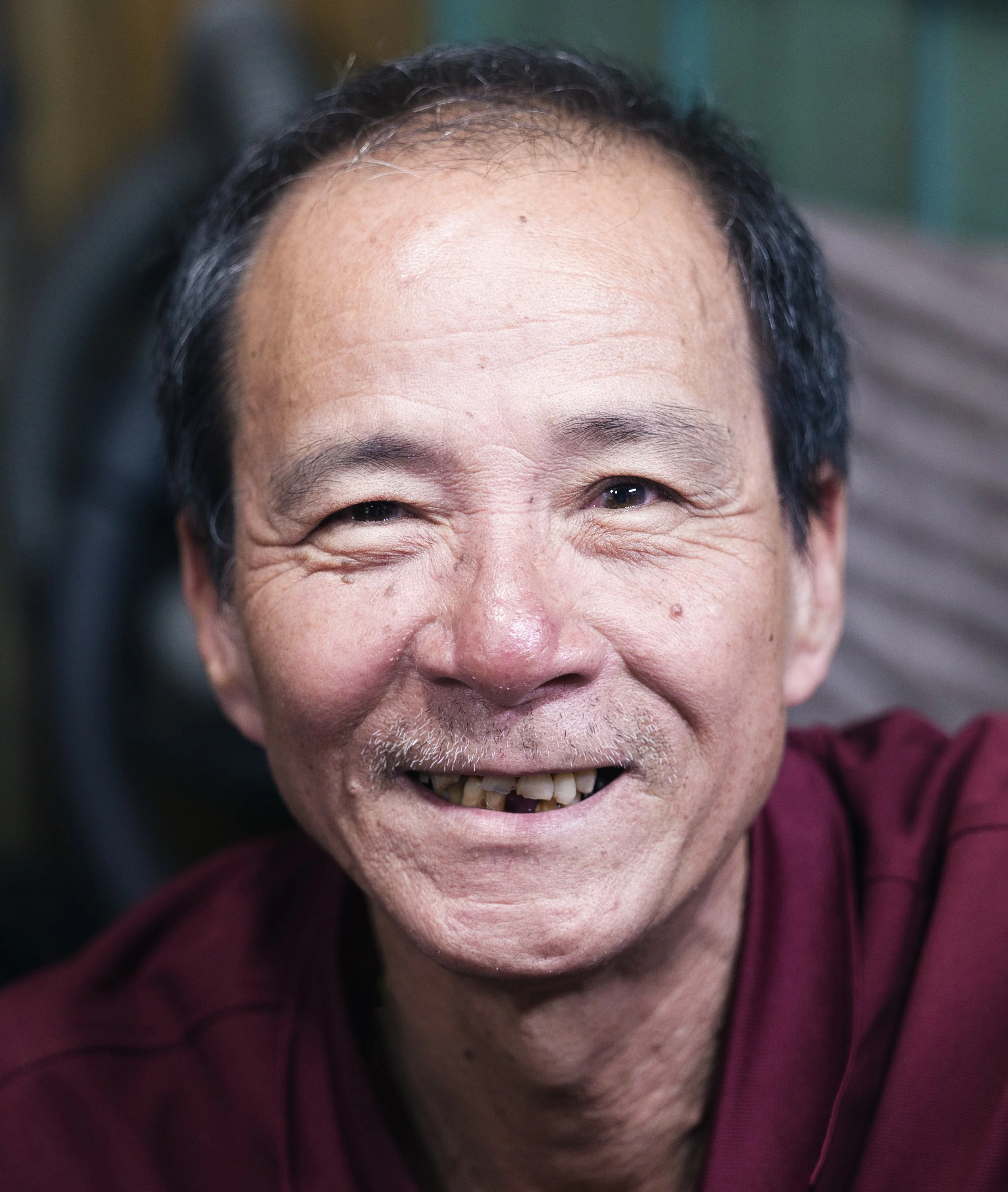 Portrait of a smiling man in Ho Chi Minh City illuminated by soft natural light