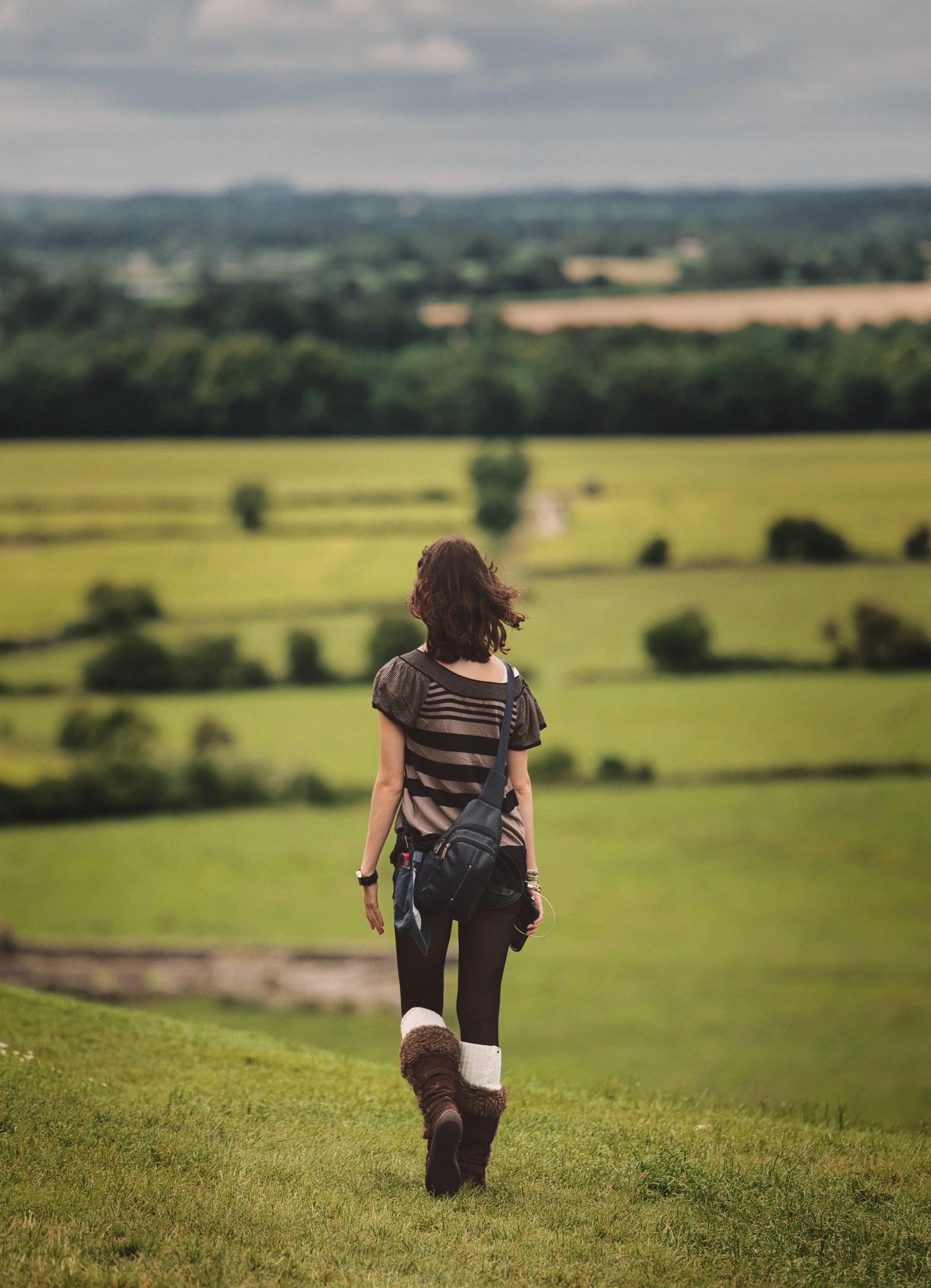 Woman overlooking the rolling countryside from the Rock of Cashel in County Tipperary, Ireland.