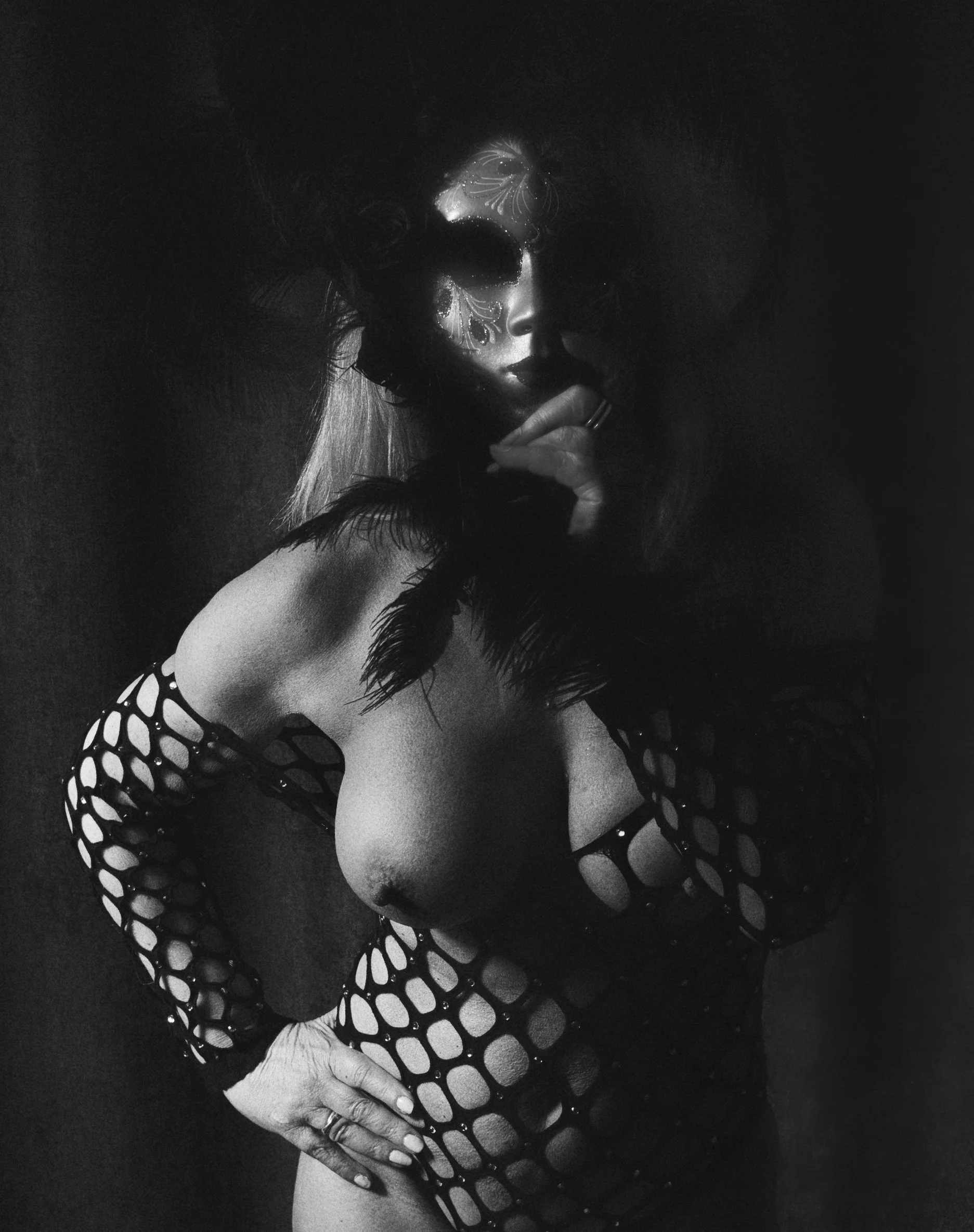 Artistic nude portrait in dramatic low key lighting