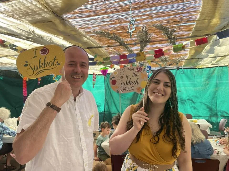 Rabbi Malcolm & Cantor Jen at the Strauss ECE Sukkot Breakfast