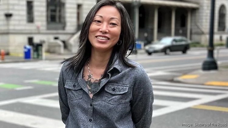 Sisters Executive Director smiles in Downtown Portland