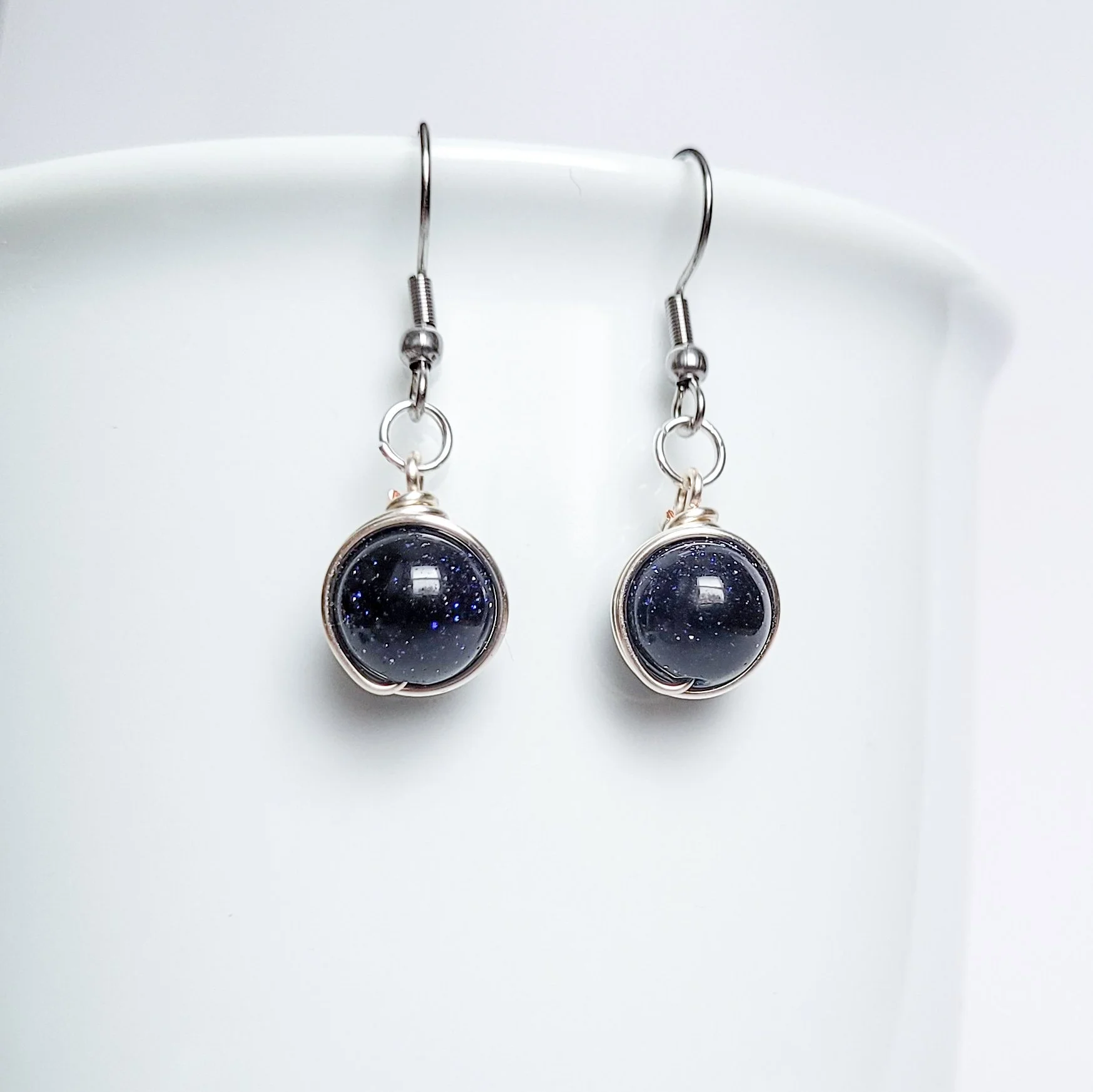 Orbit earrings in blue goldstone, simple artisan gemstone drop earrings for day to night outfits