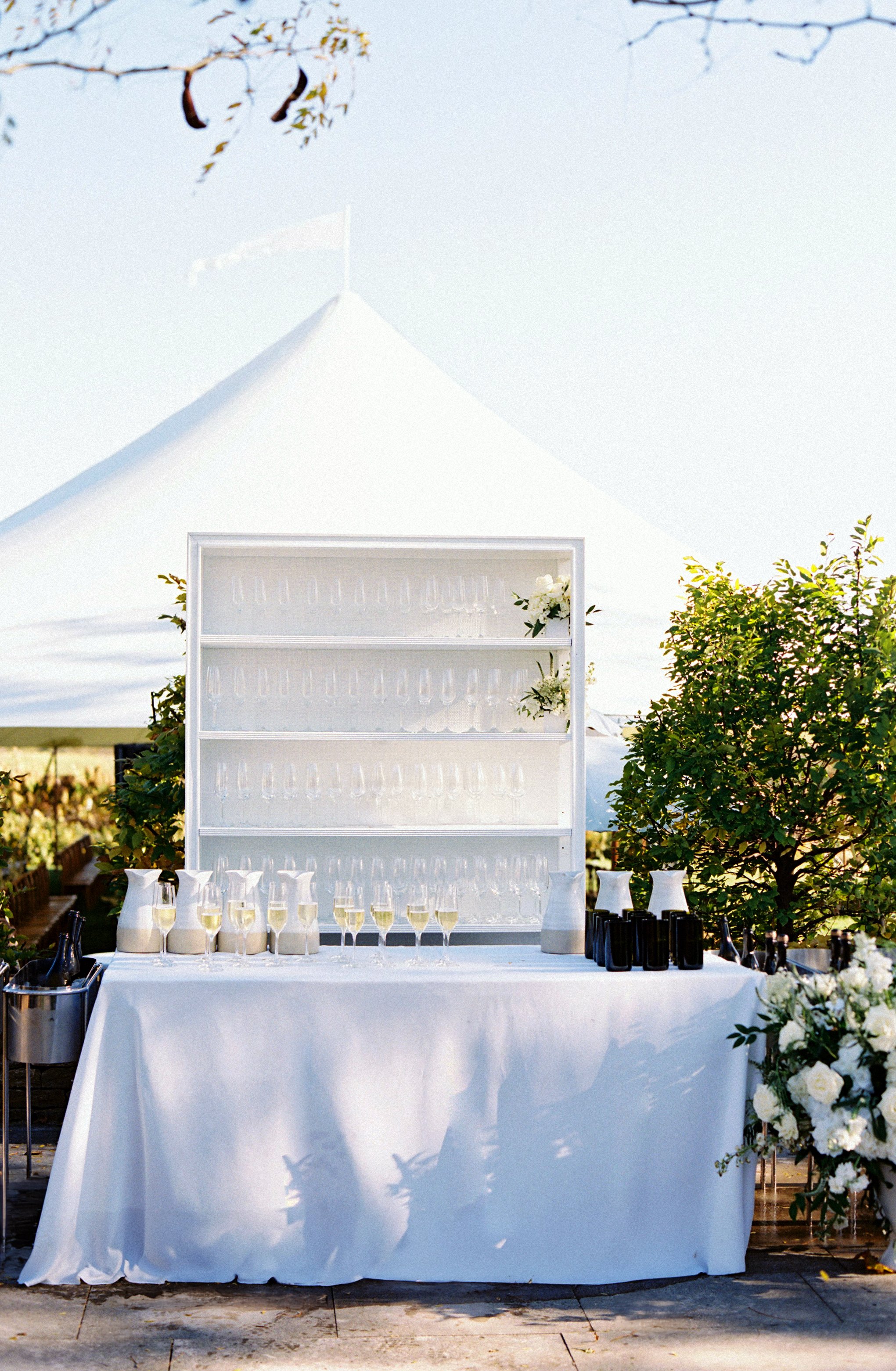 Wedding ceremony welcome champagne bar at Ashbourne Farms designed by Makers House