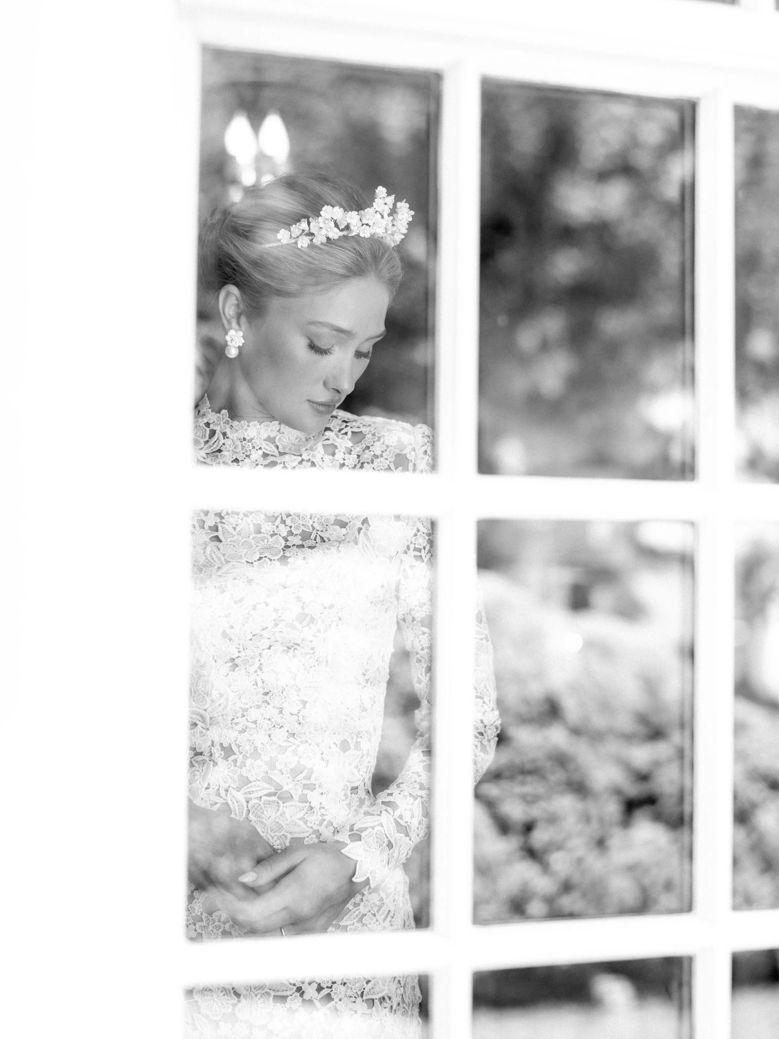 bride peering out the window on her wedding day in paris kentucky