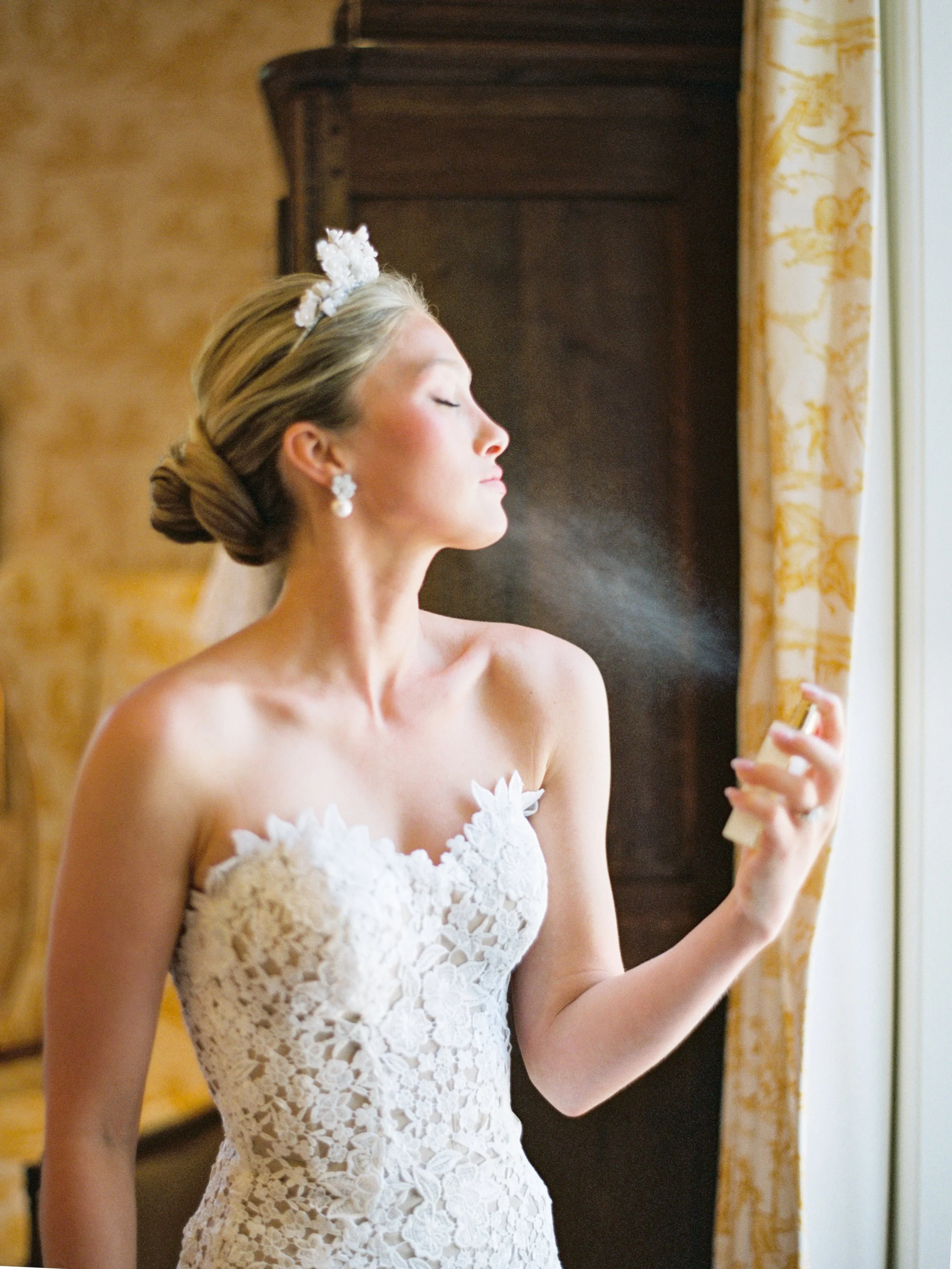 Bride putting on perfume on wedding day in paris kentucky
