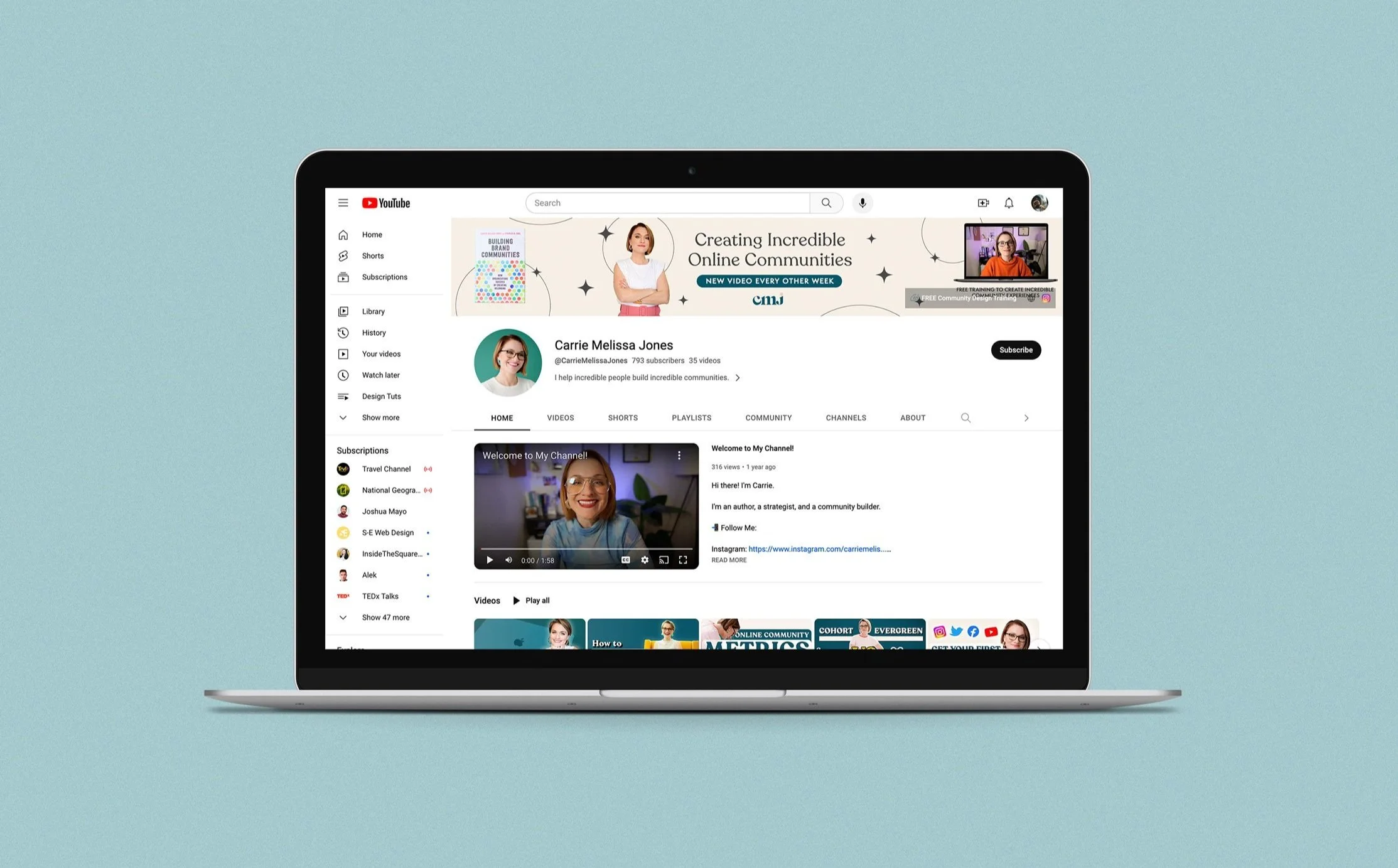 Open laptop displaying a YouTube channel homepage with a video of a smiling woman in the center, on a light blue background.