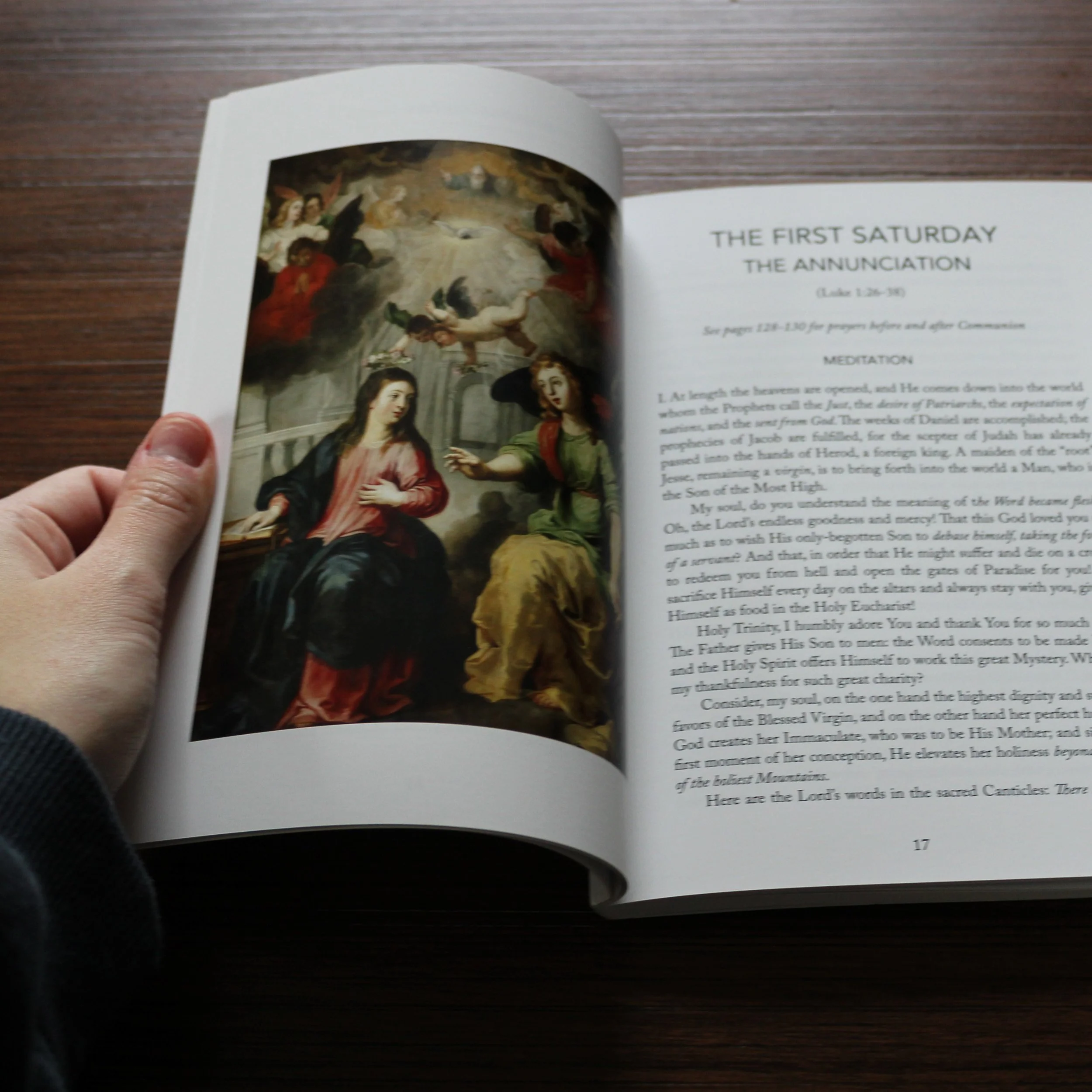 The Fifteen Saturdays book opened to the Annunciation meditation and sacred painting