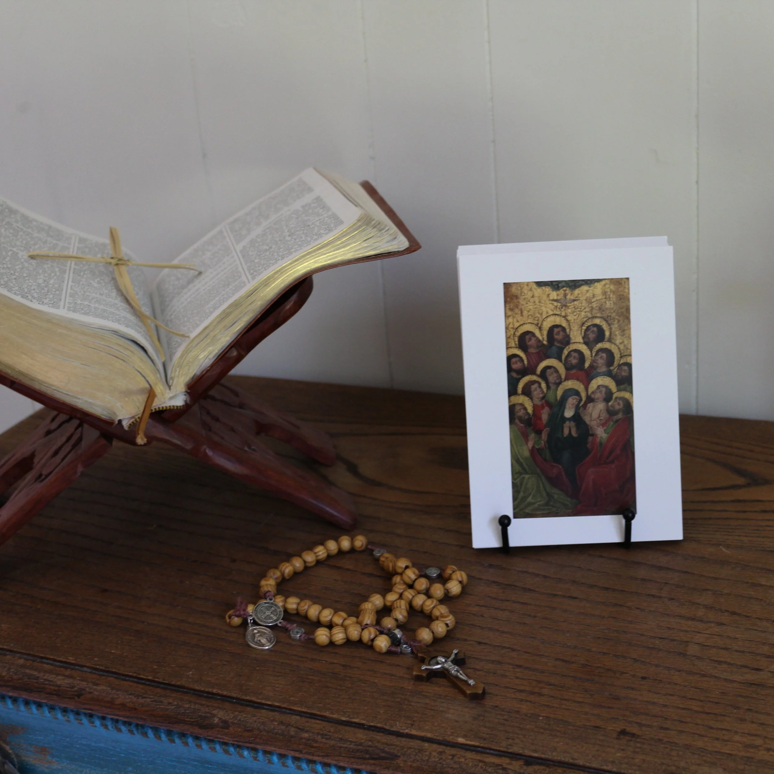 Liturgical year devotional cards displayed in a Catholic prayer corner