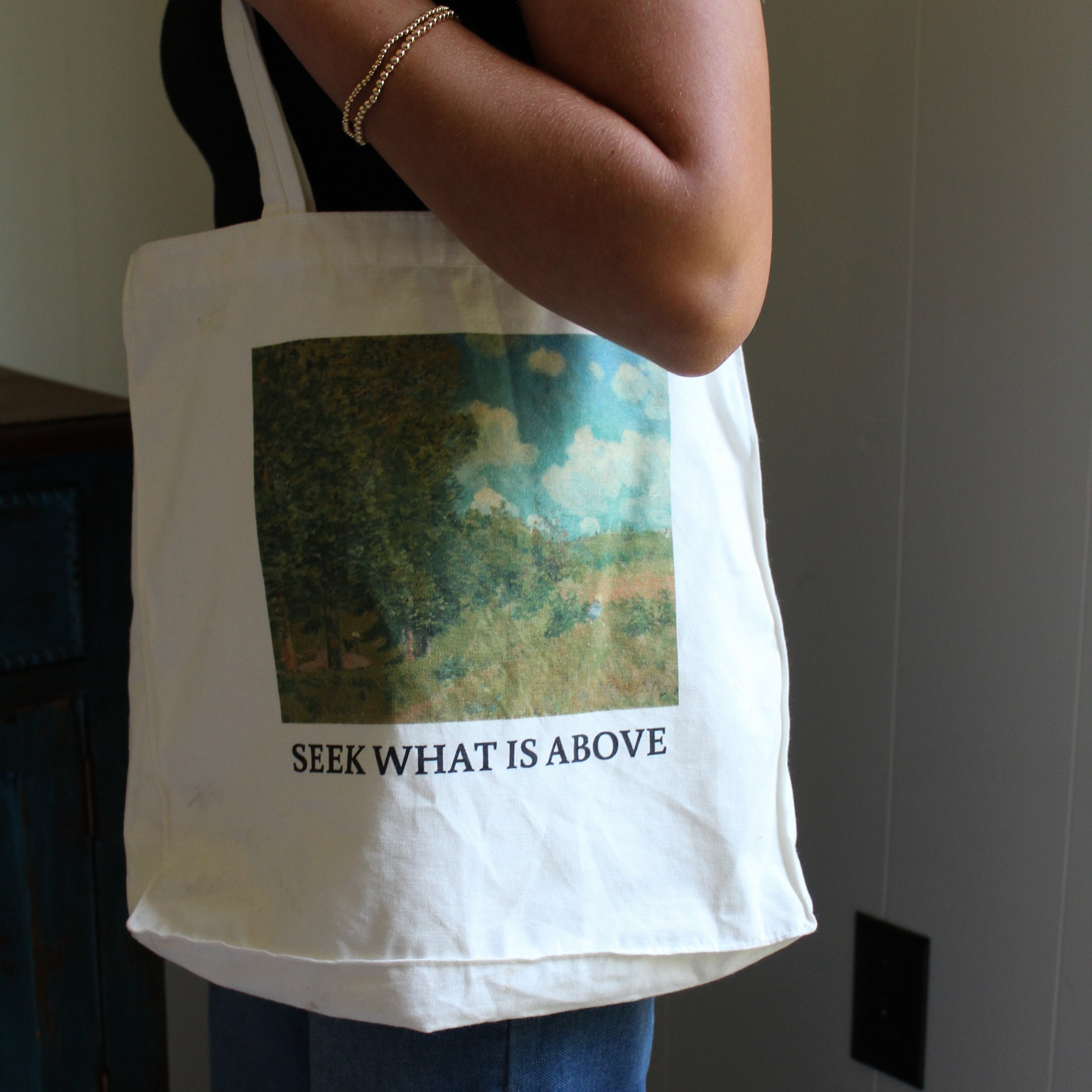 Christian tote bag with "Seek What Is Above" Scripture verse