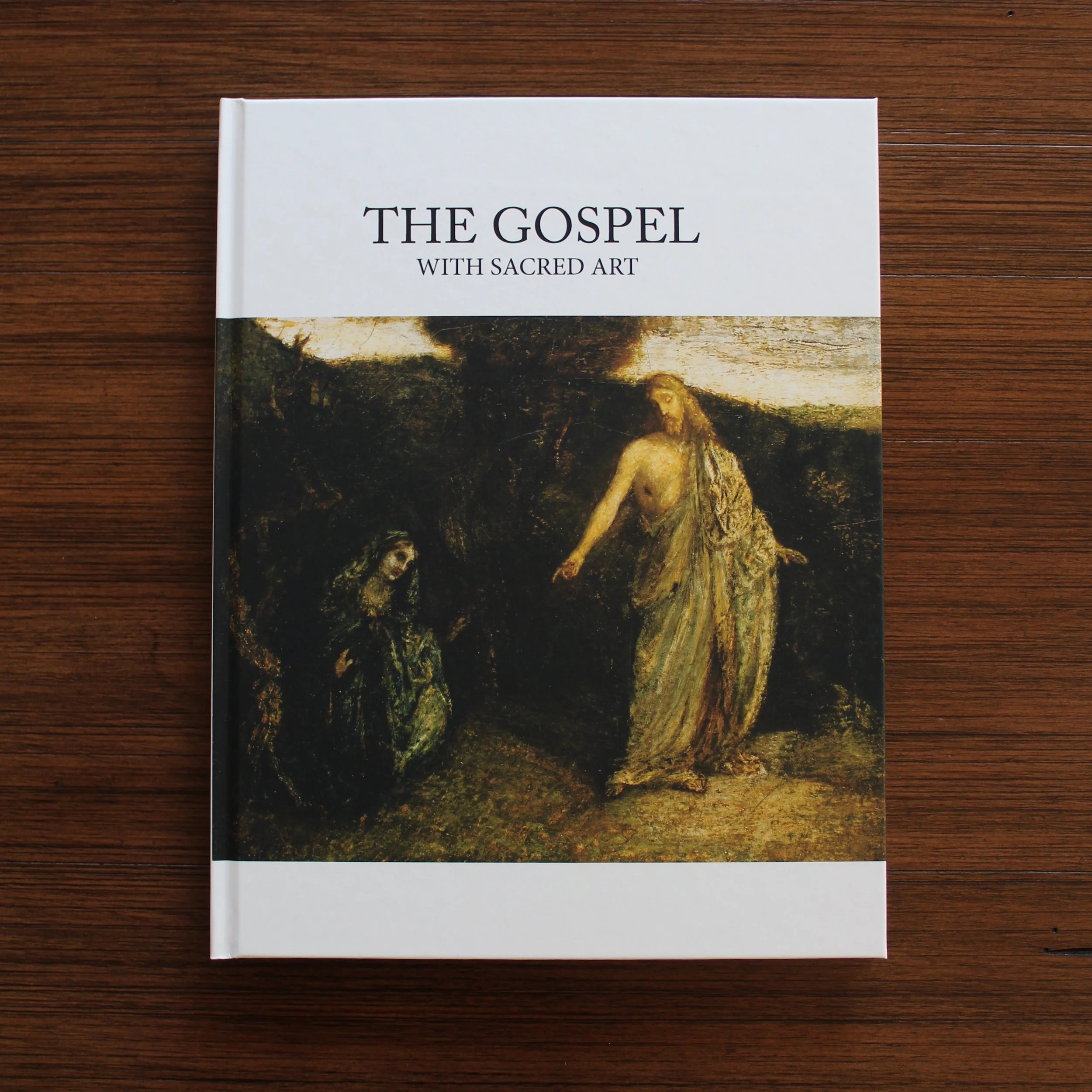 The Gospel with Sacred Art displayed on a coffee table