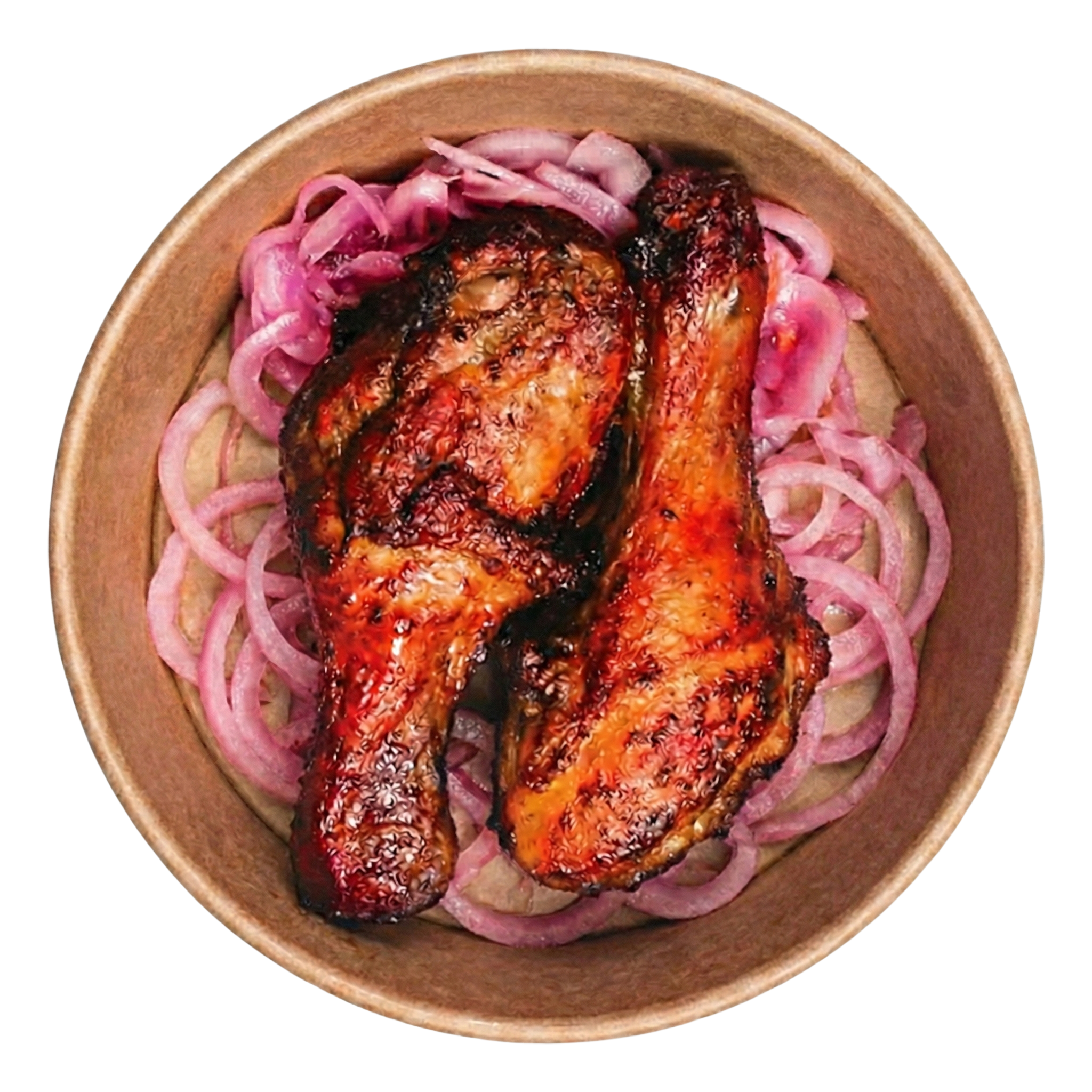 Two glazed roasted chicken drumsticks placed on shredded purple cabbage and carrots in a cardboard box.