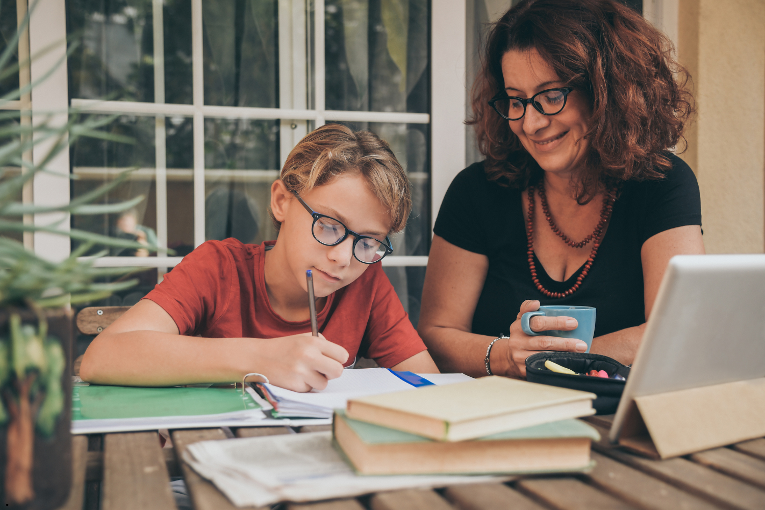 mother helping dyslexic child with homework