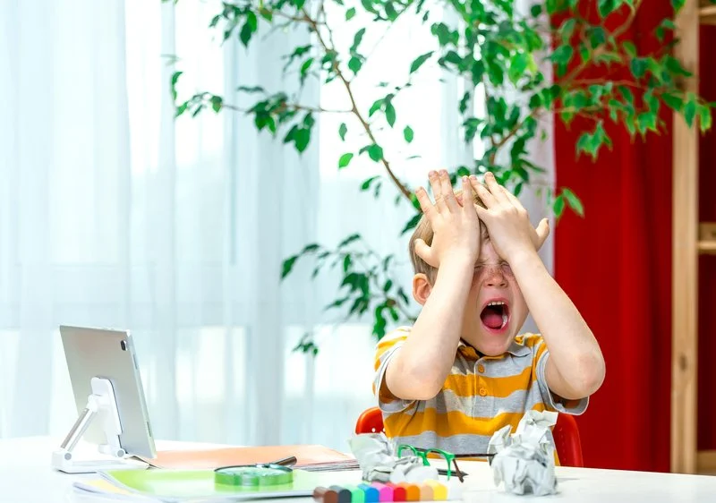 Dyslexic Child feeling overwhelmed during schoolwork and writing tasks