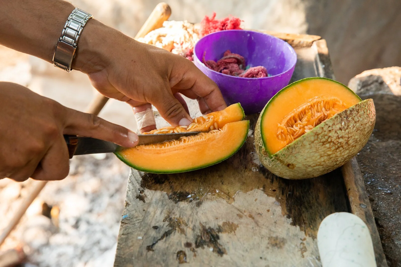 cutting-canteloupe-organic-produce-homegrown-garden-honduras-melon.jpeg