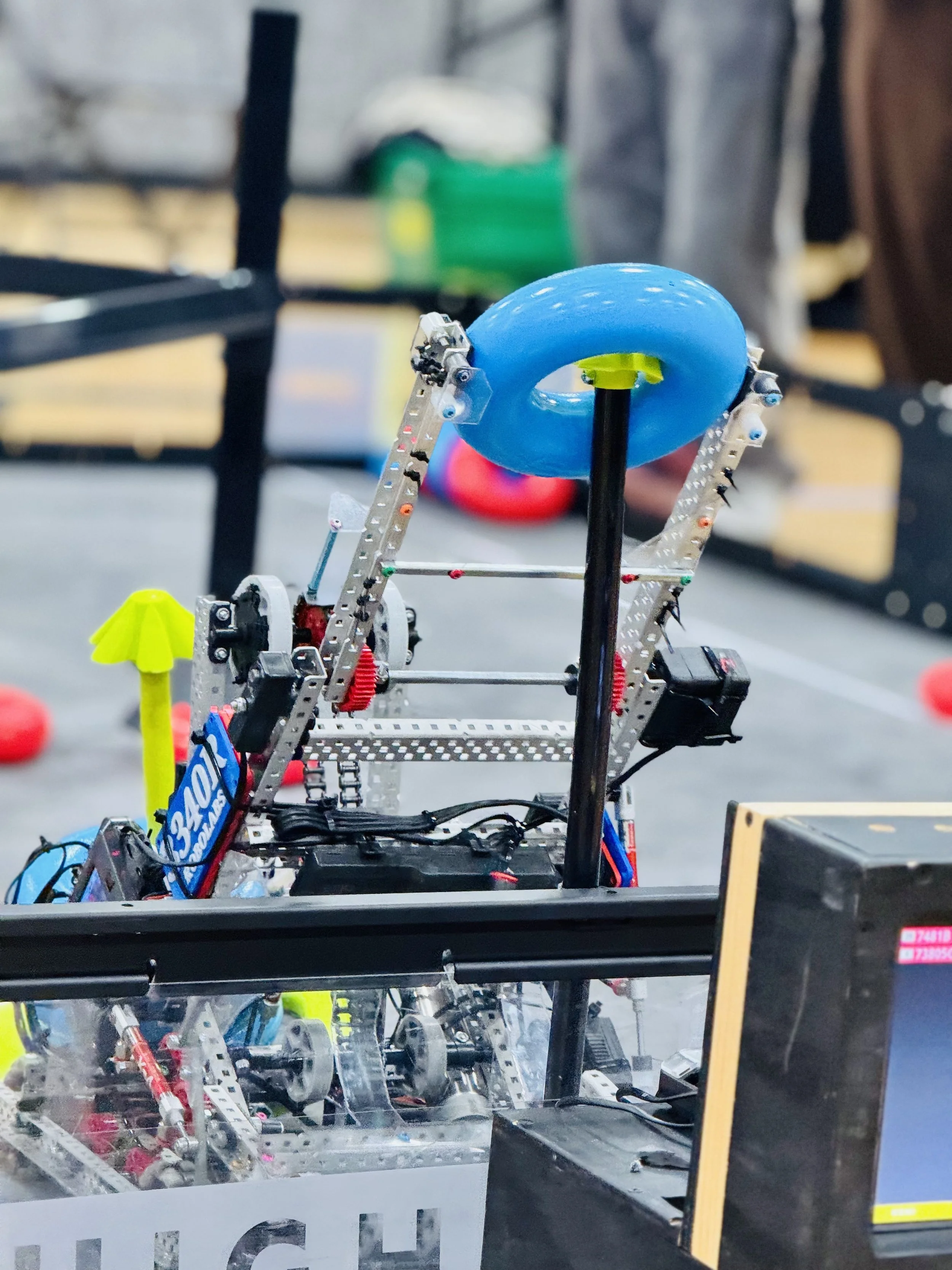 VEX AI competition robot using advanced sensors and mechanical systems to complete an autonomous robotics challenge on the competition field.
