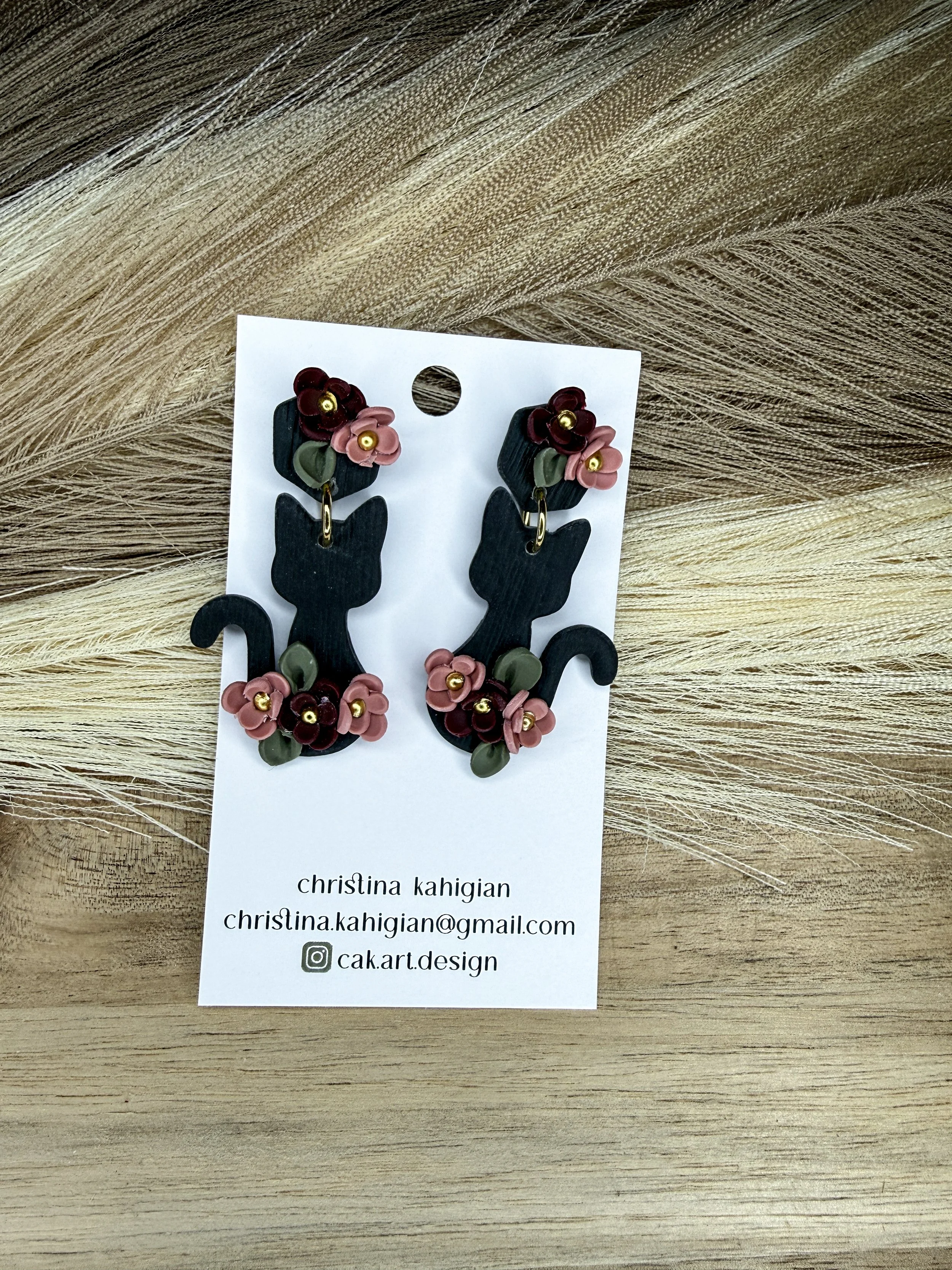 black cat with pink florals