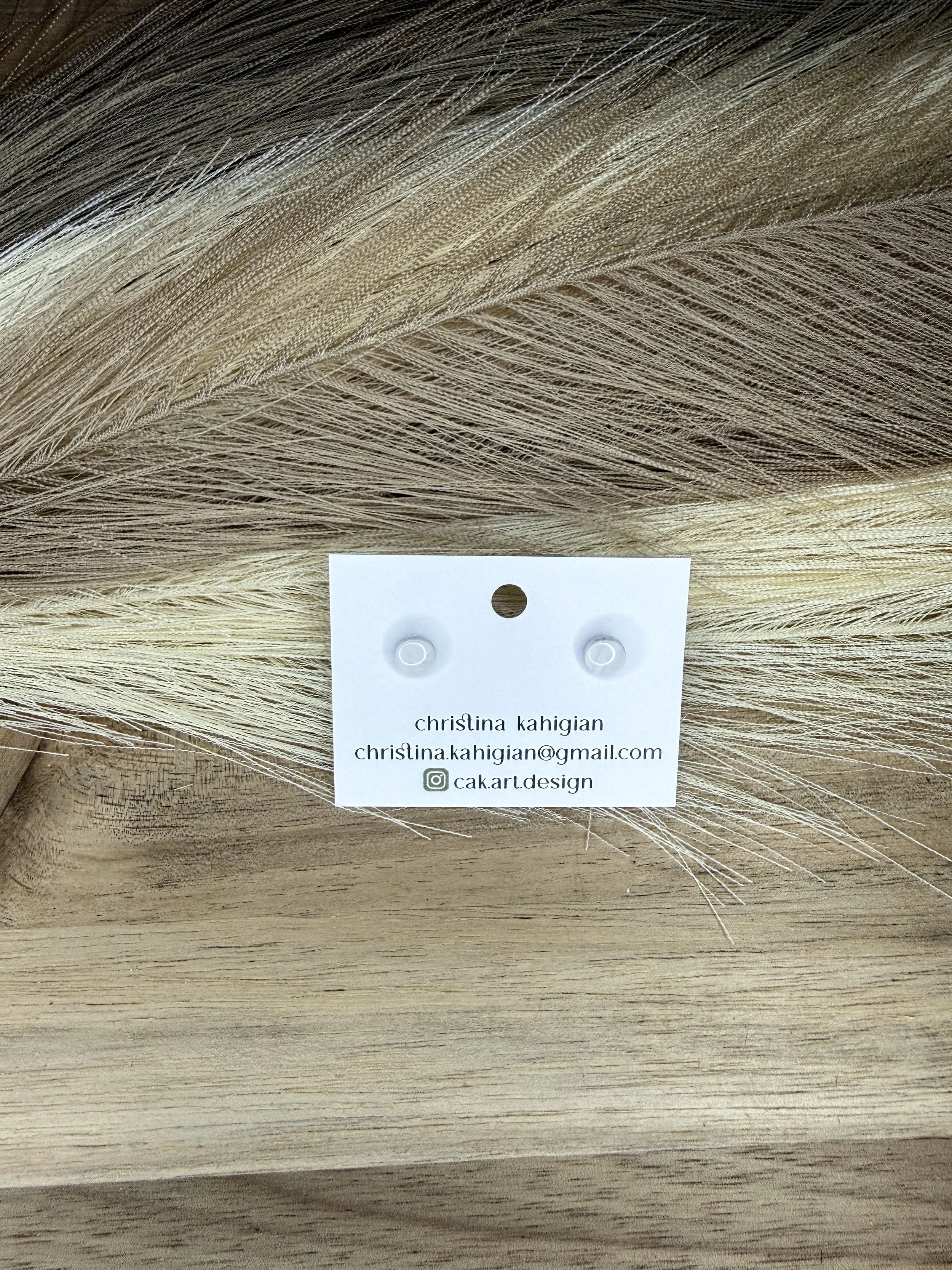 tini white with brown marble