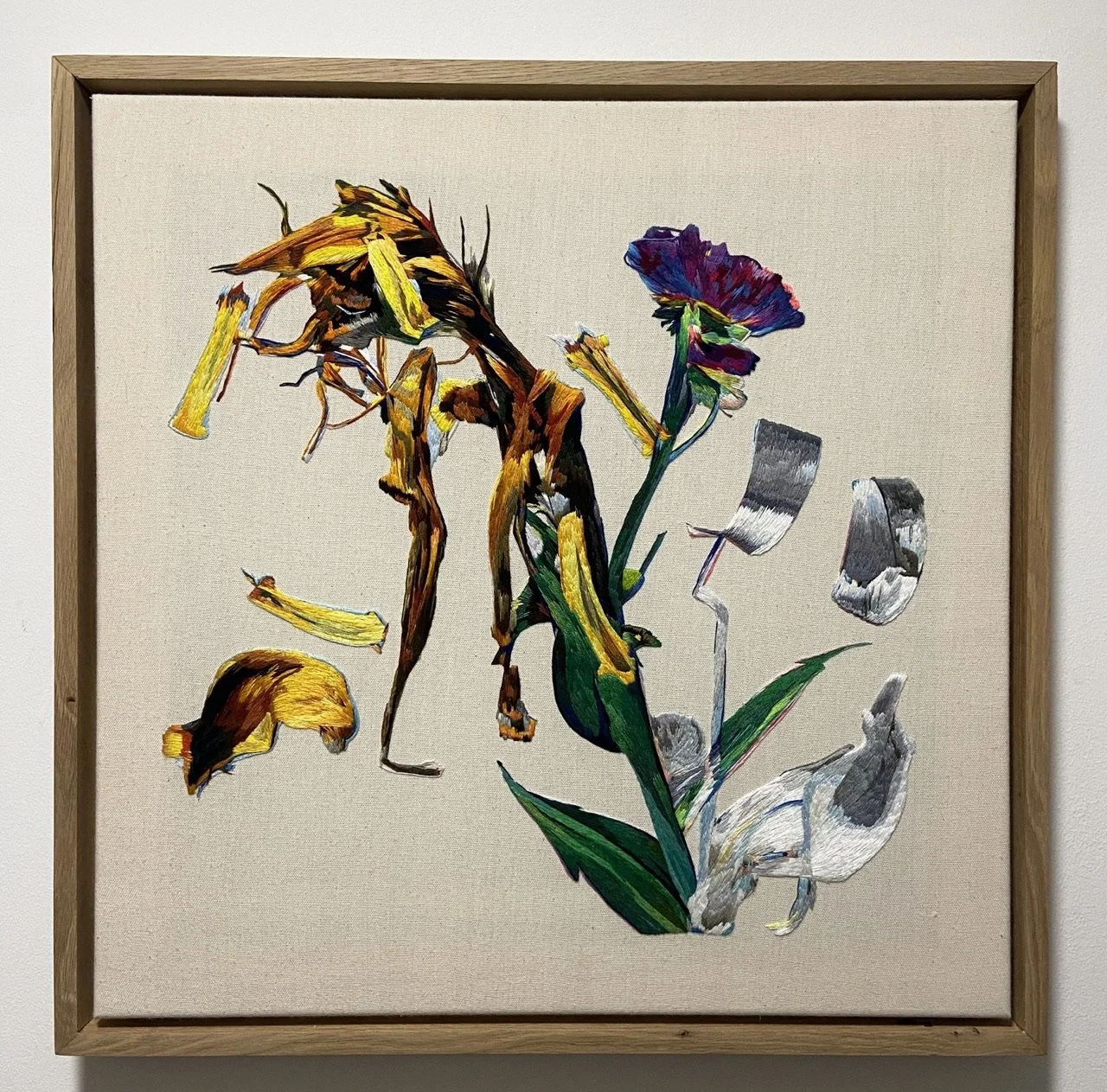 Hand embroidered floral thread painting by Lucy Newman, showing a digitally distorted botanical form built through dense stitched colour.