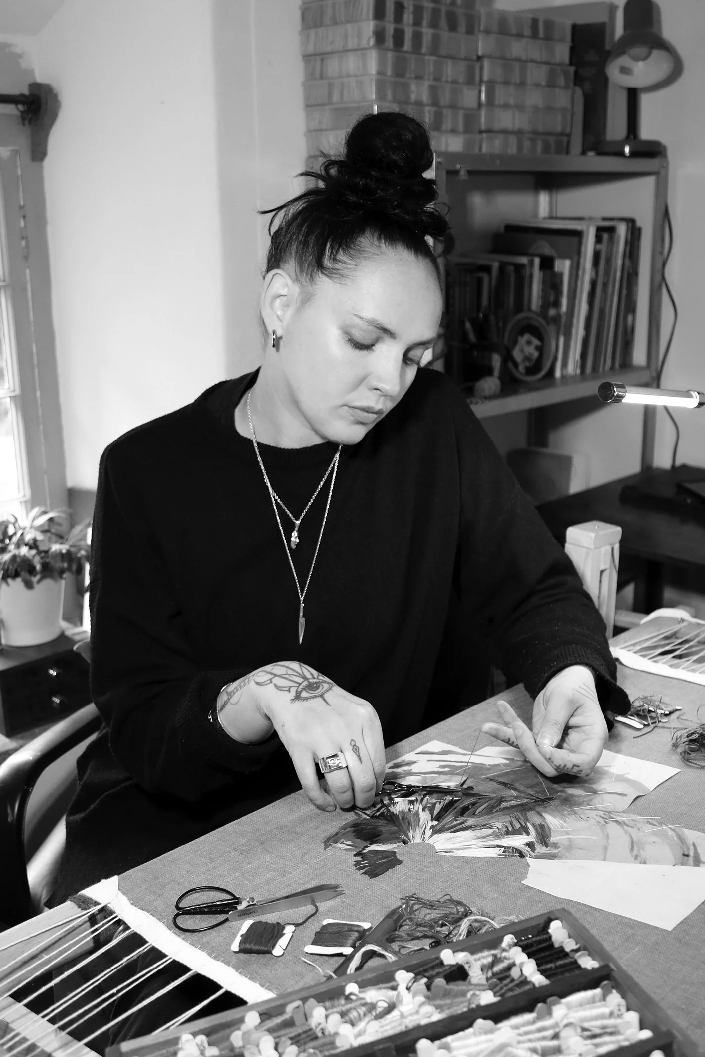 Portrait of Lucy Newman, a UK hand embroidery artist creating contemporary embroidery art and thread paintings.