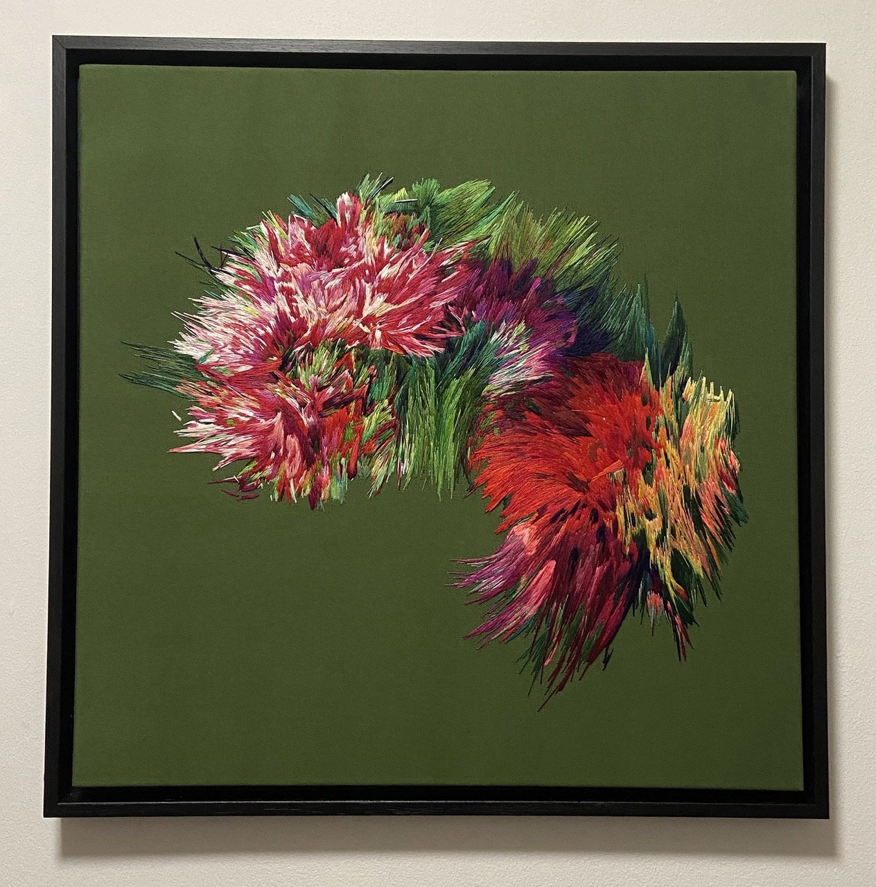 Hand embroidered textile artwork by Lucy Newman, with layered thread painting creating a glitched and unstable natural form.