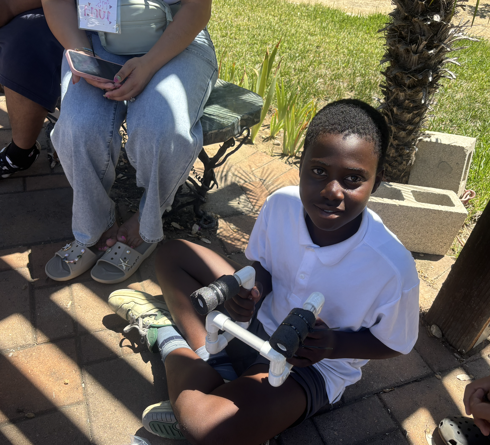 kid smiling with his robot