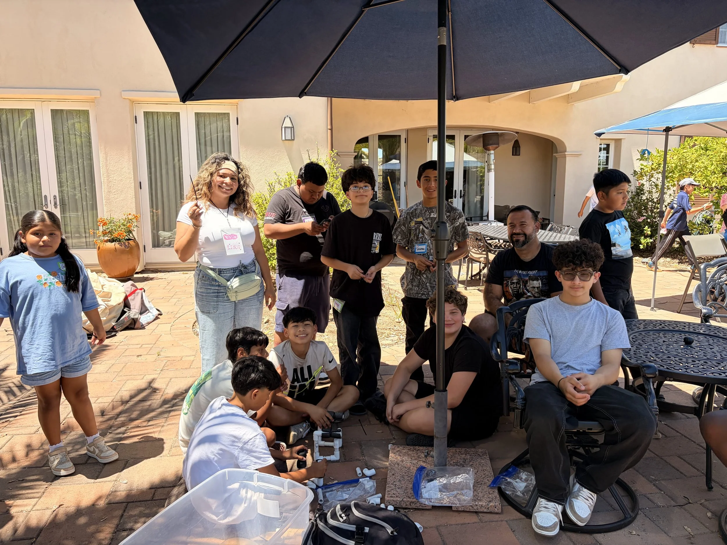urban life students smiling while building their sea perch robots