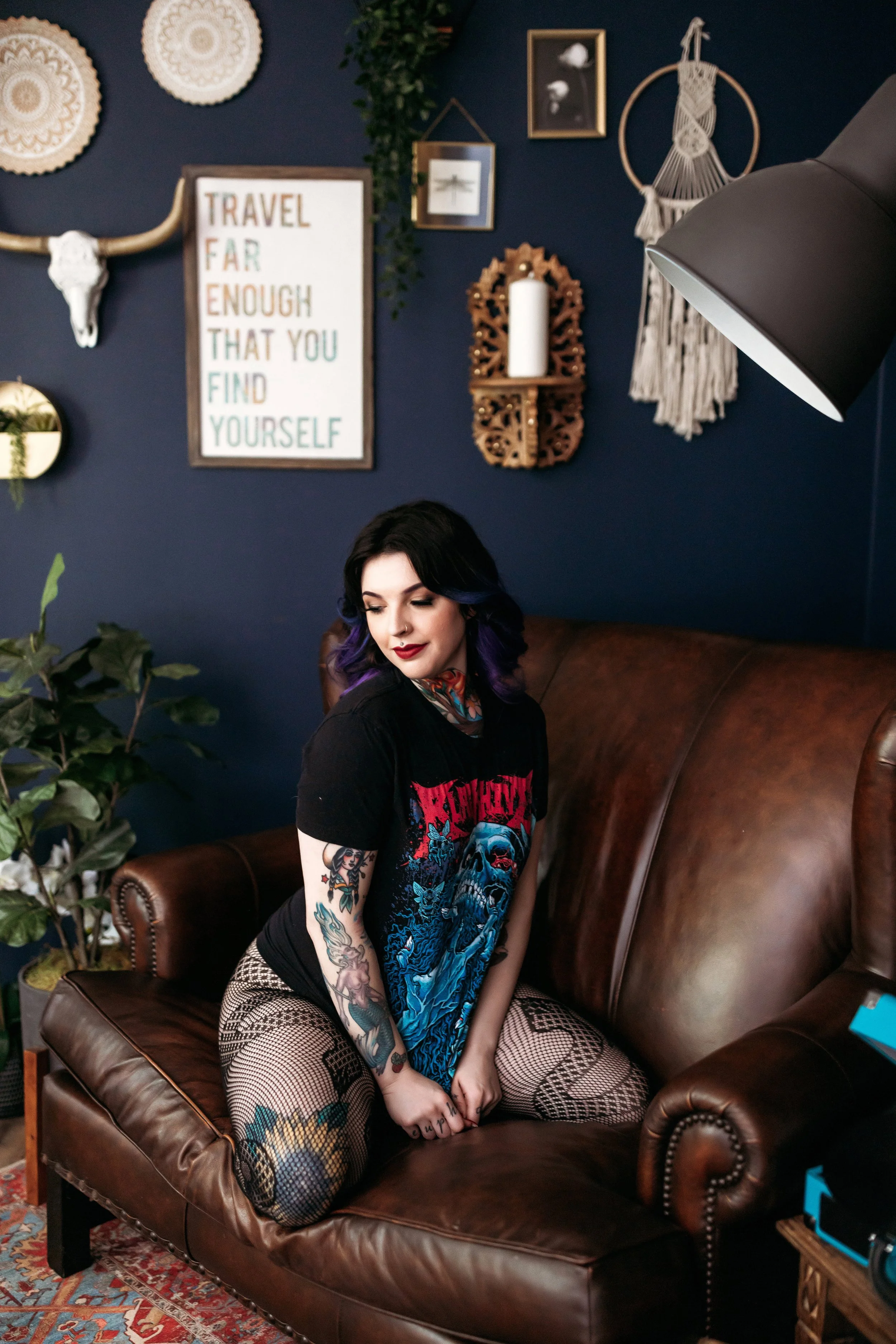 Client wearing a graphic band T-shirt with fishnet tights for a casual non-lingerie boudoir look