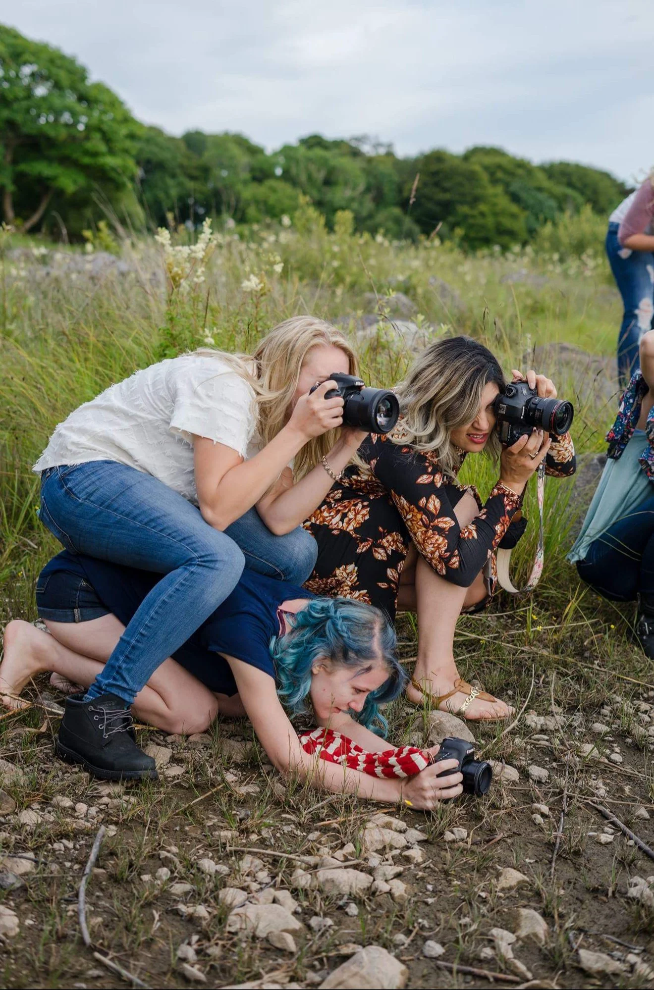 Tiffany Joyce lying on the ground with other photographers during a photography workshop in Ireland