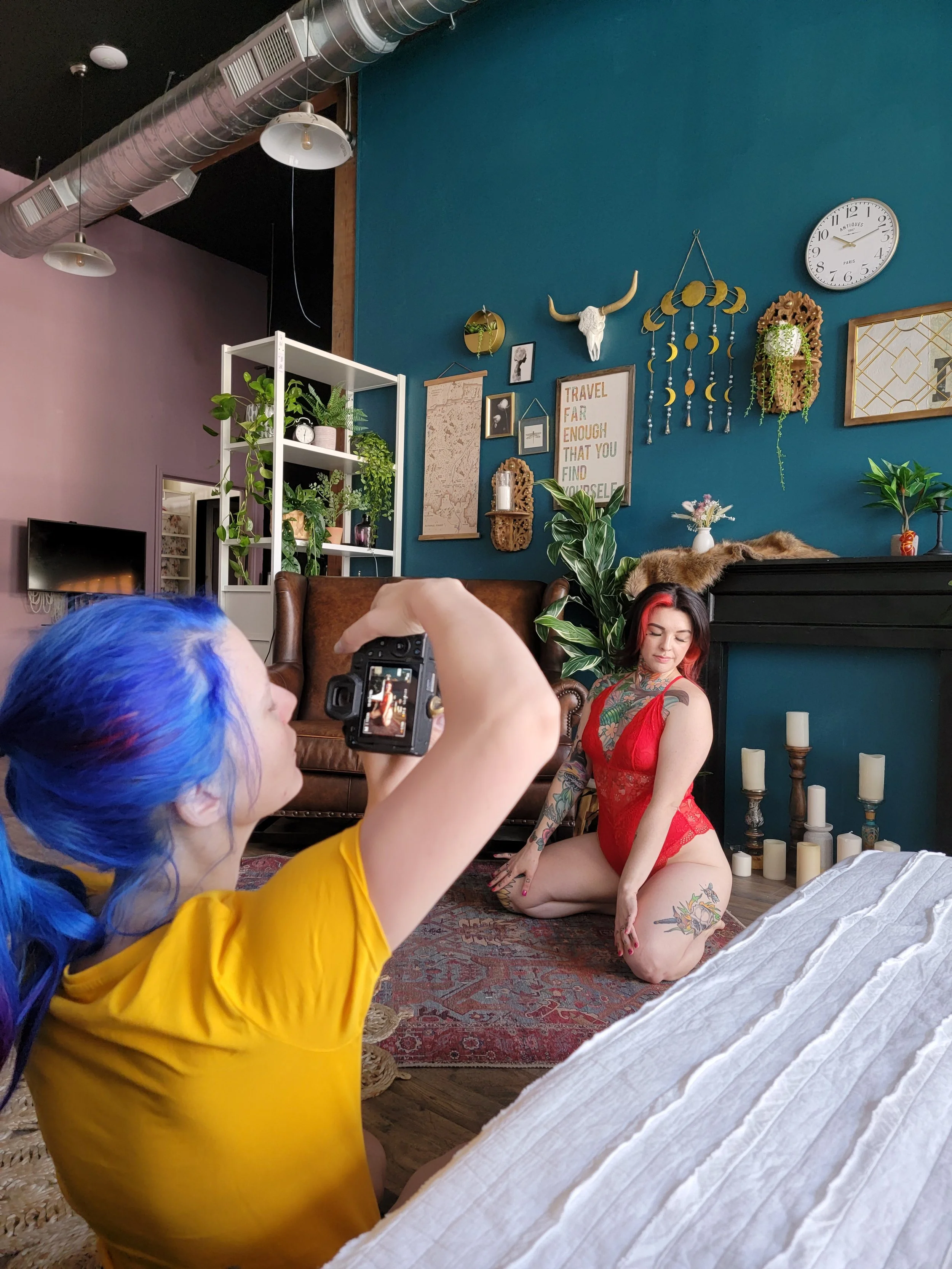 Tiffany Joyce photographing a client inside the Hype Girl Boudoir studio in Jacksonville, Florida