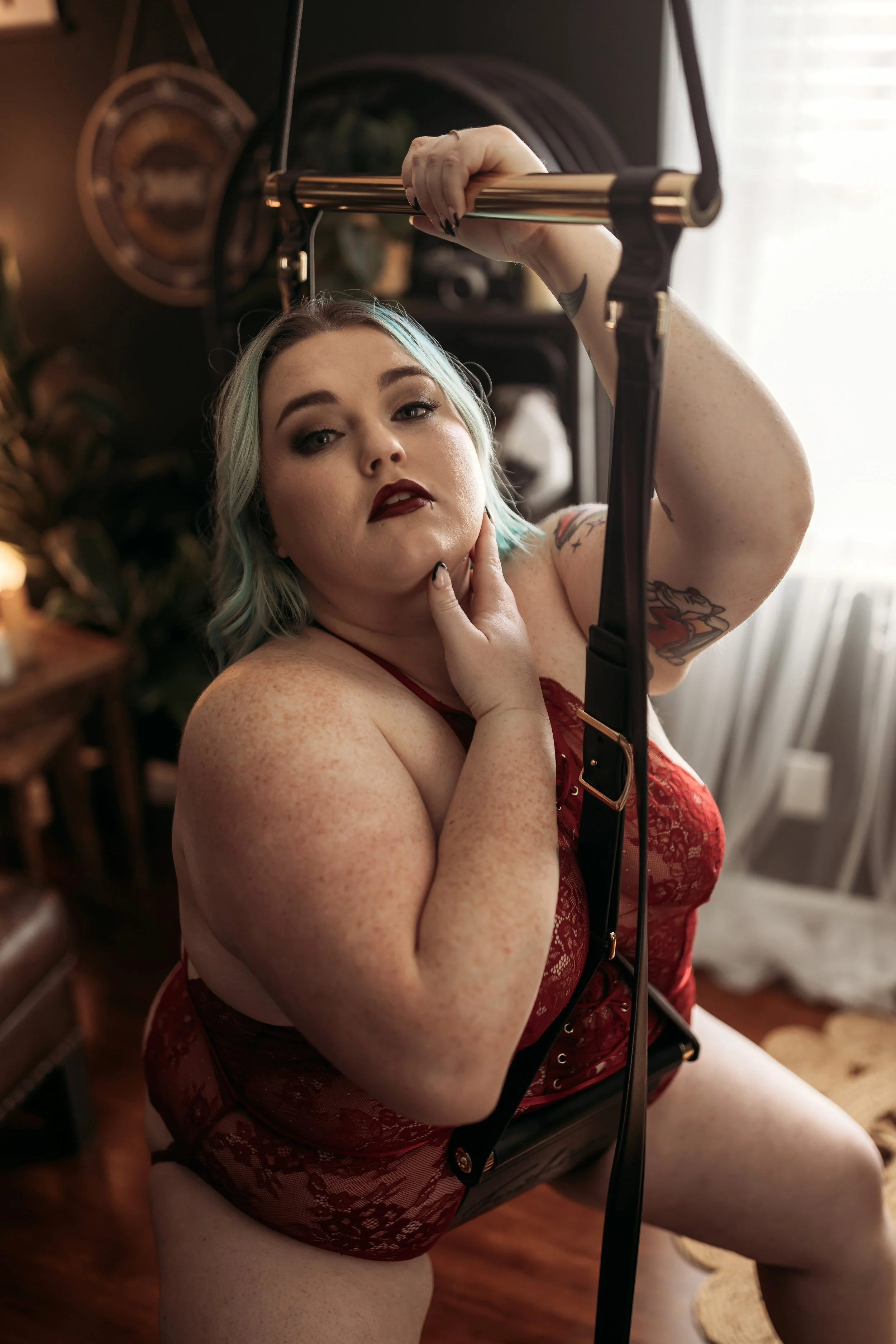 swing-boudoir.jpgPlus-size client wearing red Torrid lingerie from the Hype Girl Client Closet on the studio sex swing