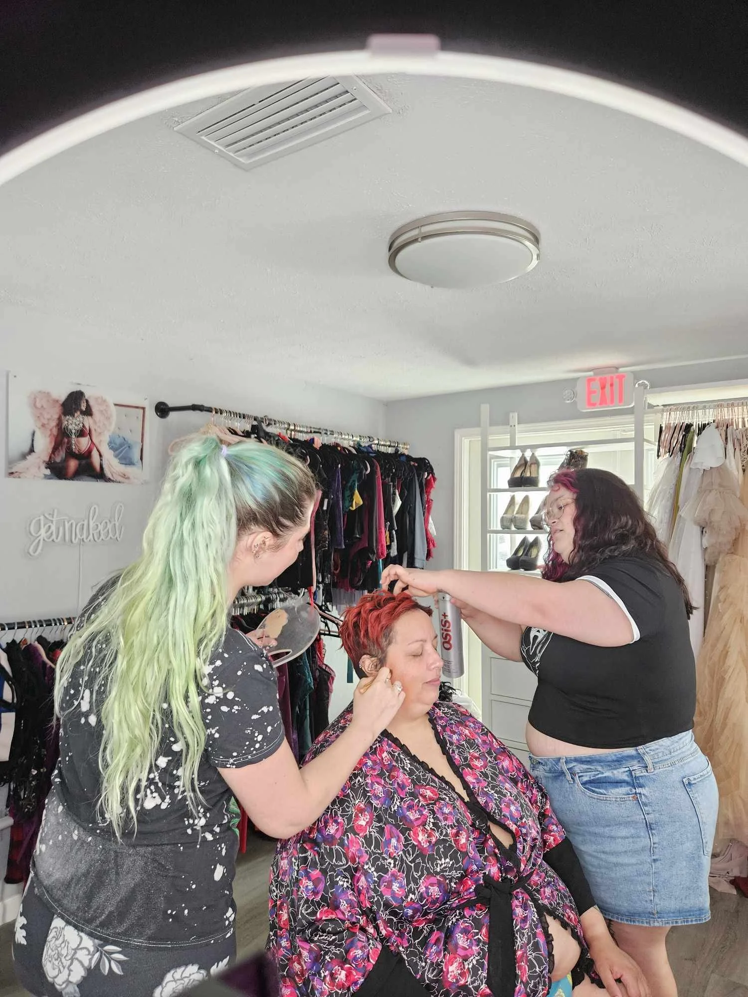 Client getting professional hair and makeup before her boudoir session at Hype Girl Boudoir