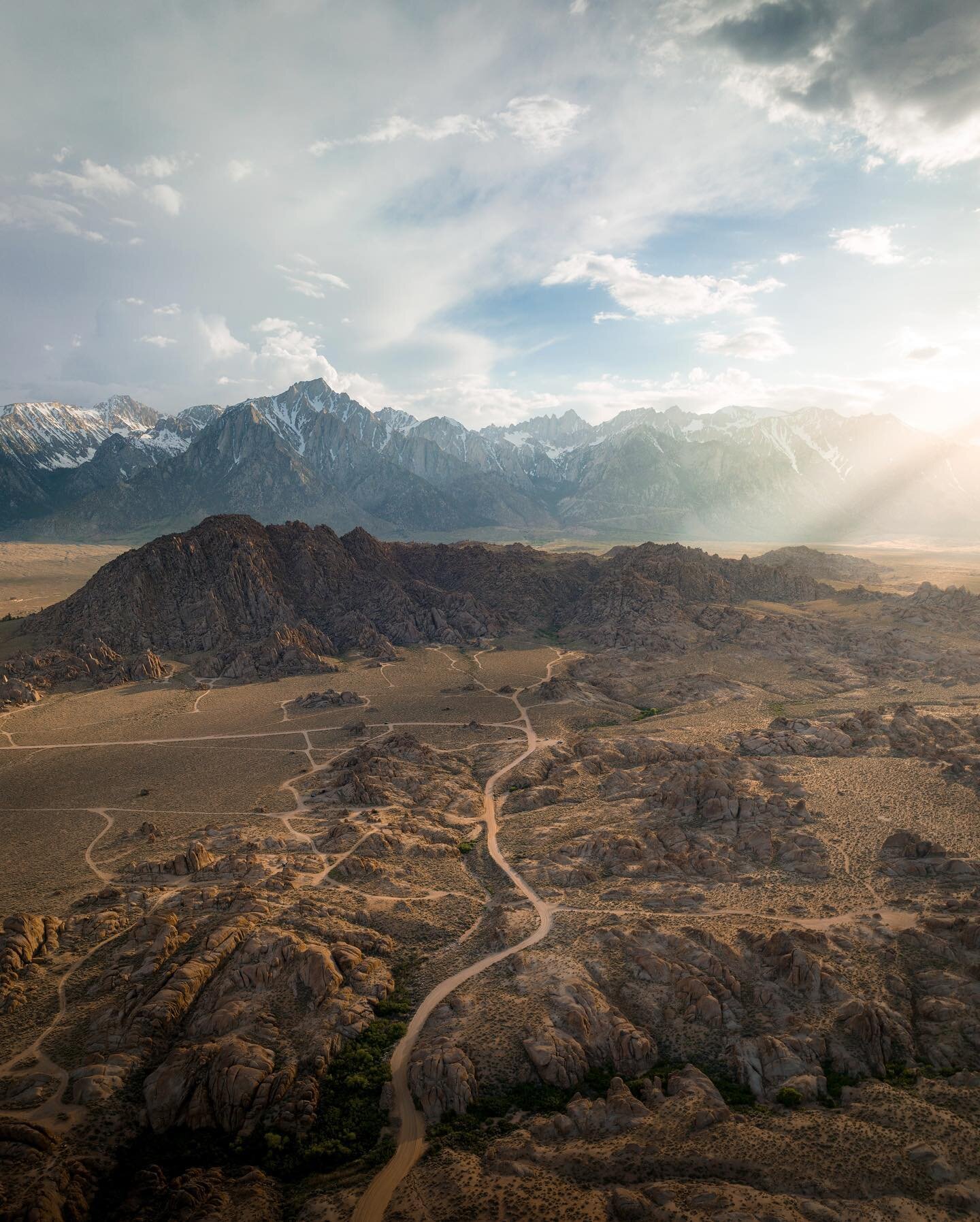 Mount Whitney towering above the Alabama Hills during golden hour on Sunday. Even had some sun beams thanks to a nearby storm. Stay tuned for the footage 😮

Shot using @djiglobal 
ND filter by @polarpro 

=========

#california #cali #mountain #moun