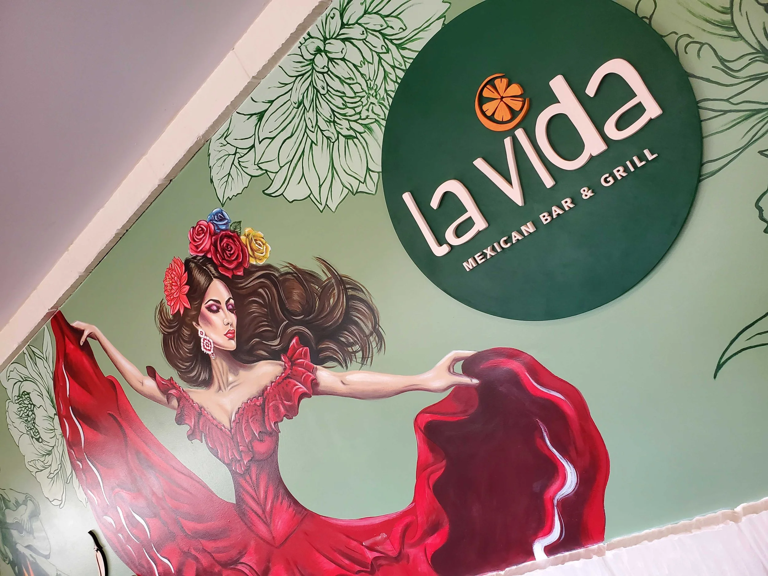 custom business logo and dancing women in a red dress mural