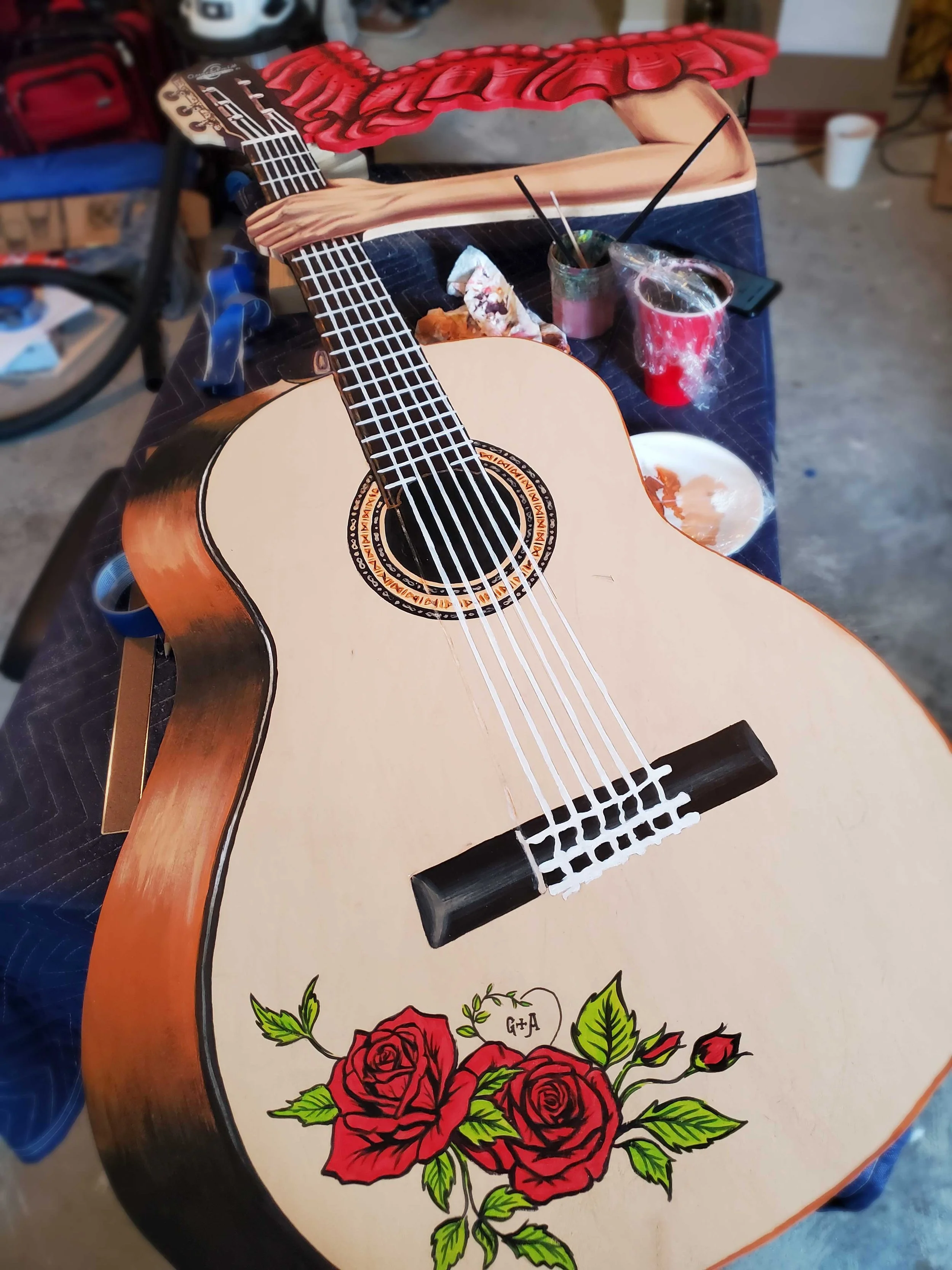 custom cut and hand-painted guitar cut-out in workshop