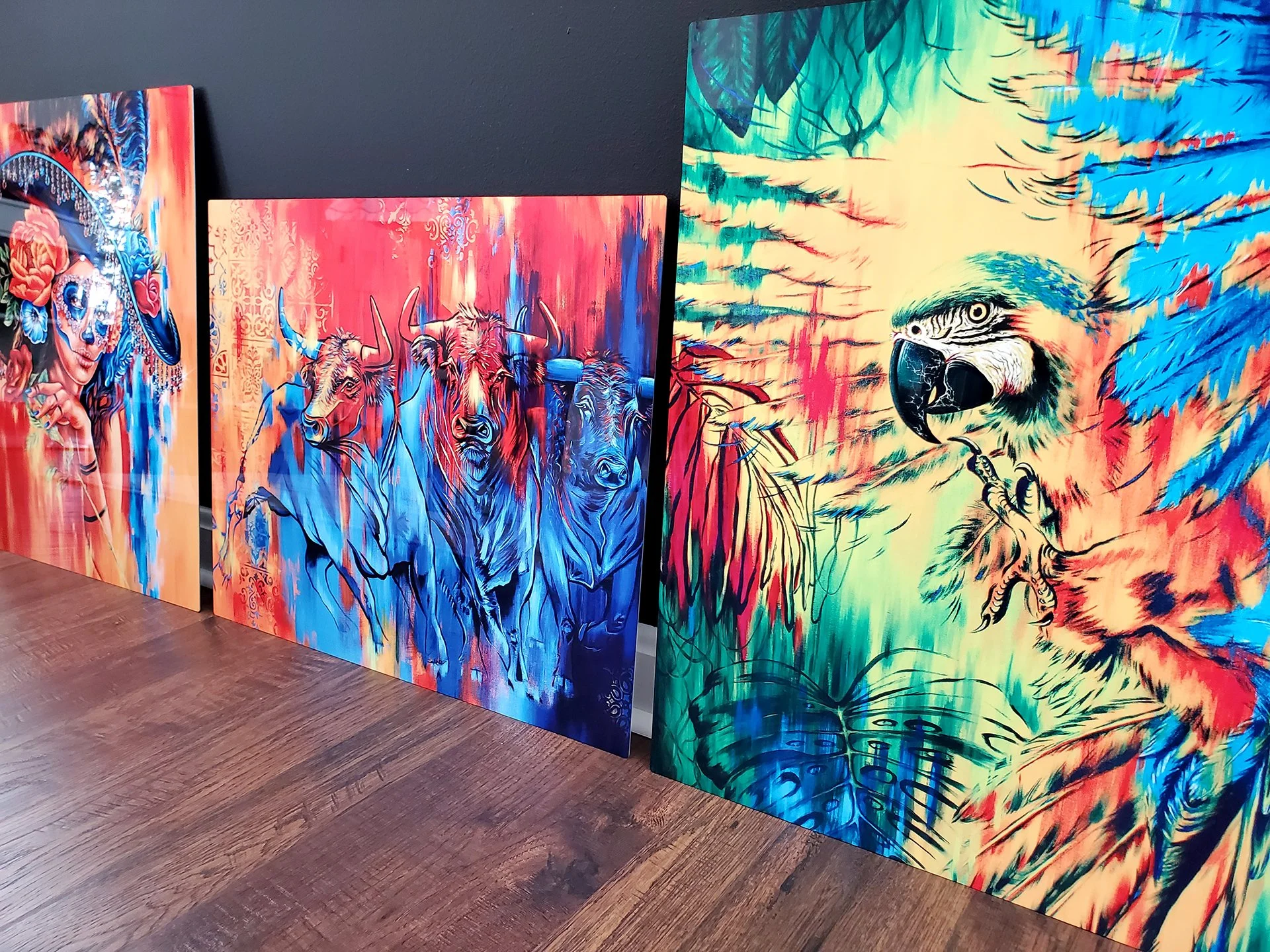 metal prints of a macaw in jungle, bulls and catrina painting