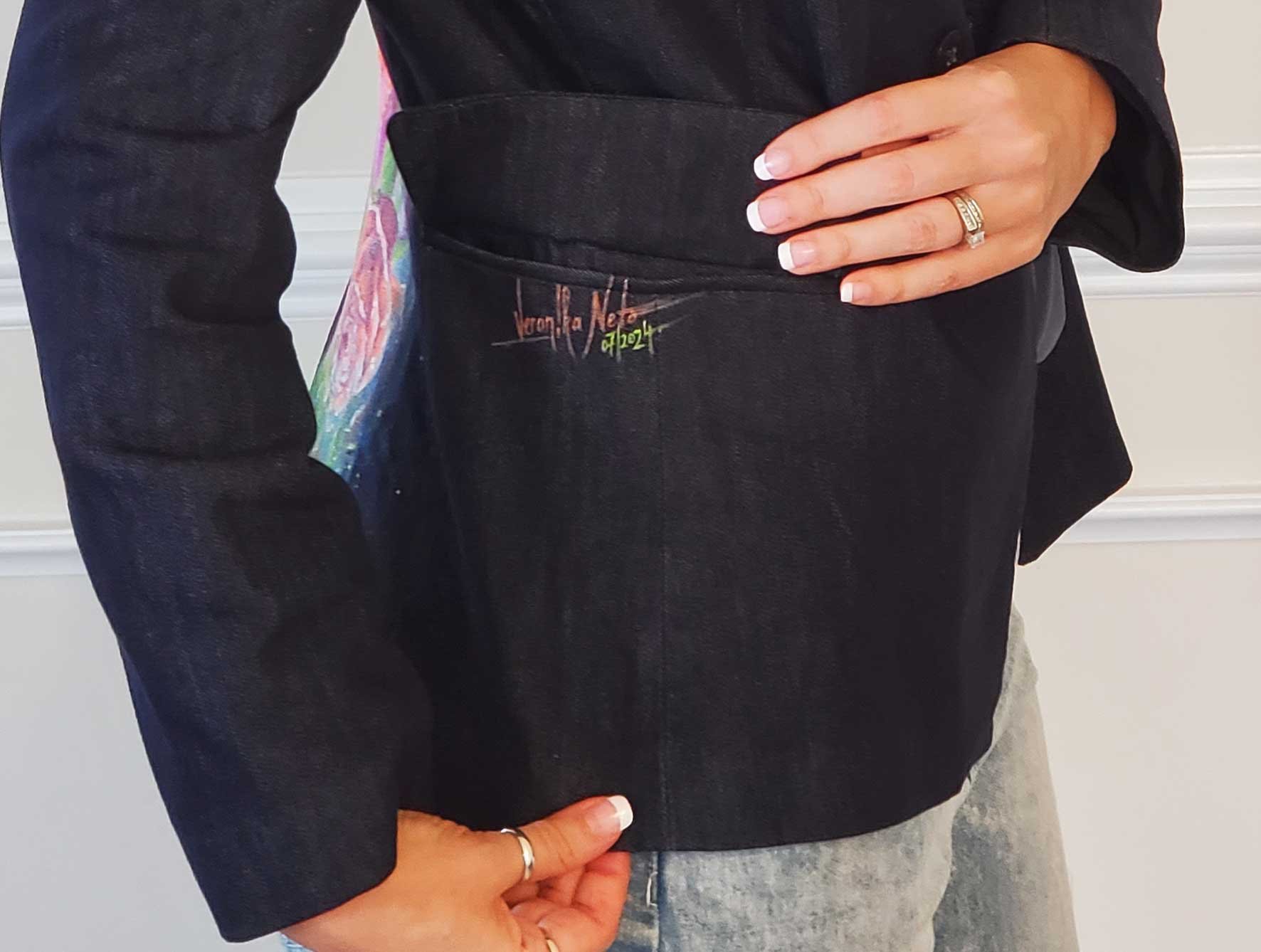 artist in signed hand-painted floral designer jacket