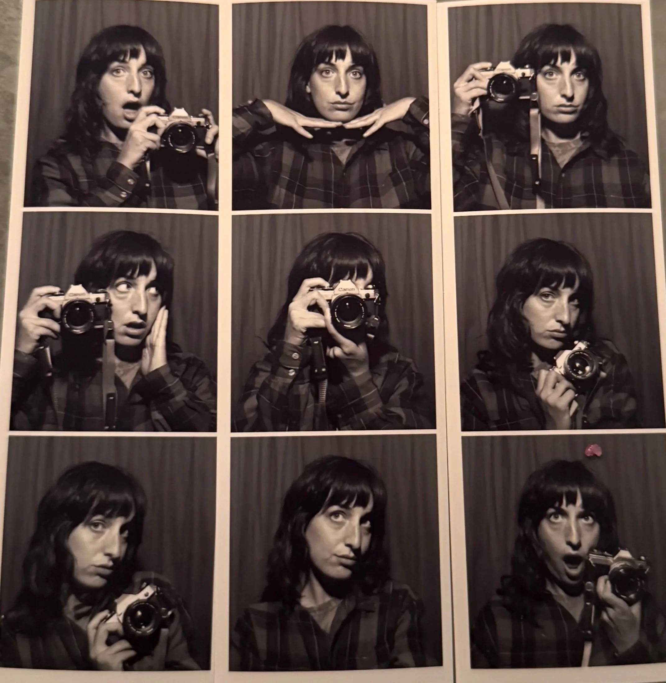 Black-and-white photo of a woman with dark, wavy hair, holding a camera in different poses, in a grid of six images.