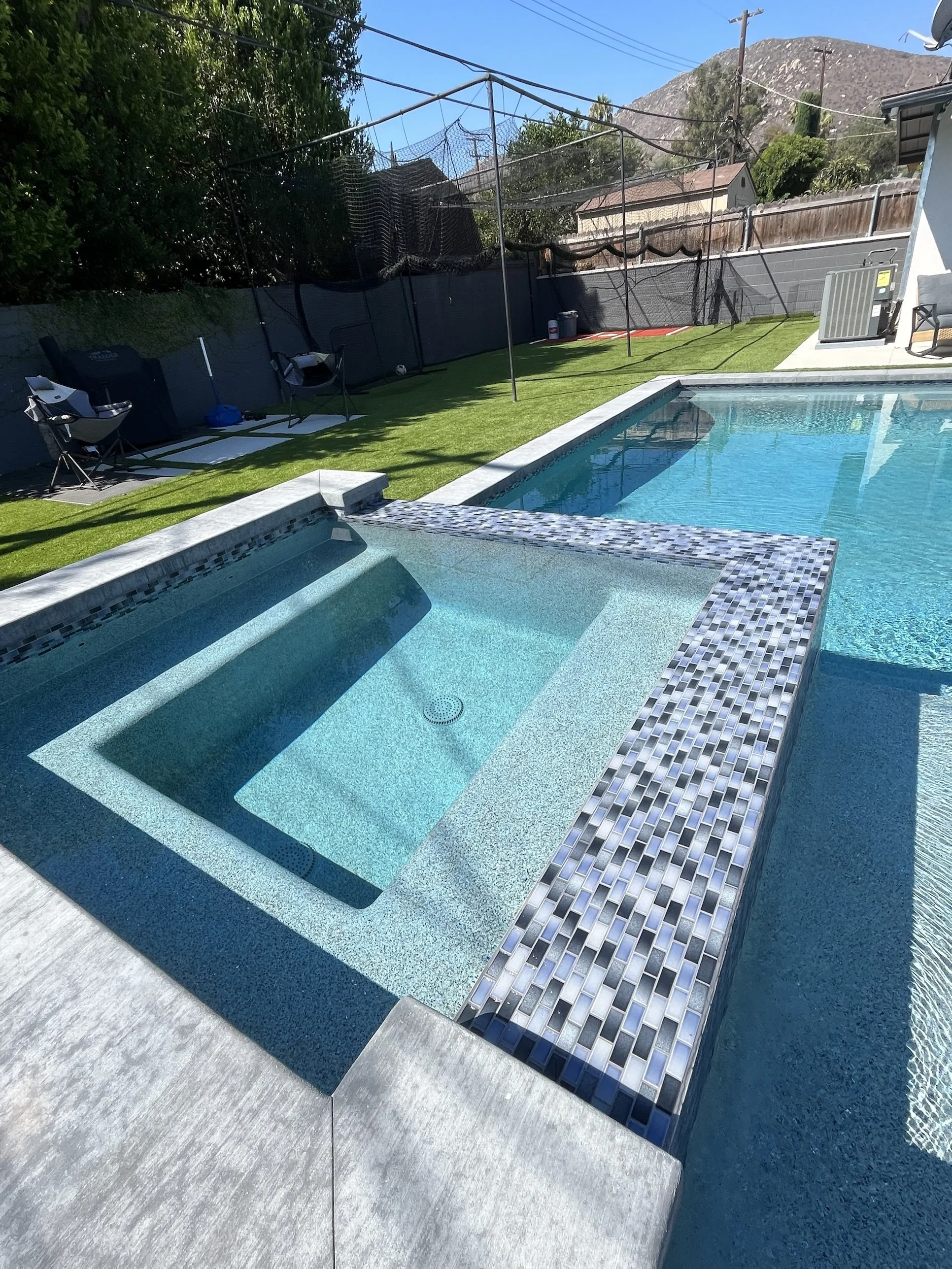 Custom Pool with Raised Spa and Glass Tile