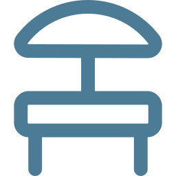 A simplified line drawing of a table with an umbrella, indicating an outdoor seating area.