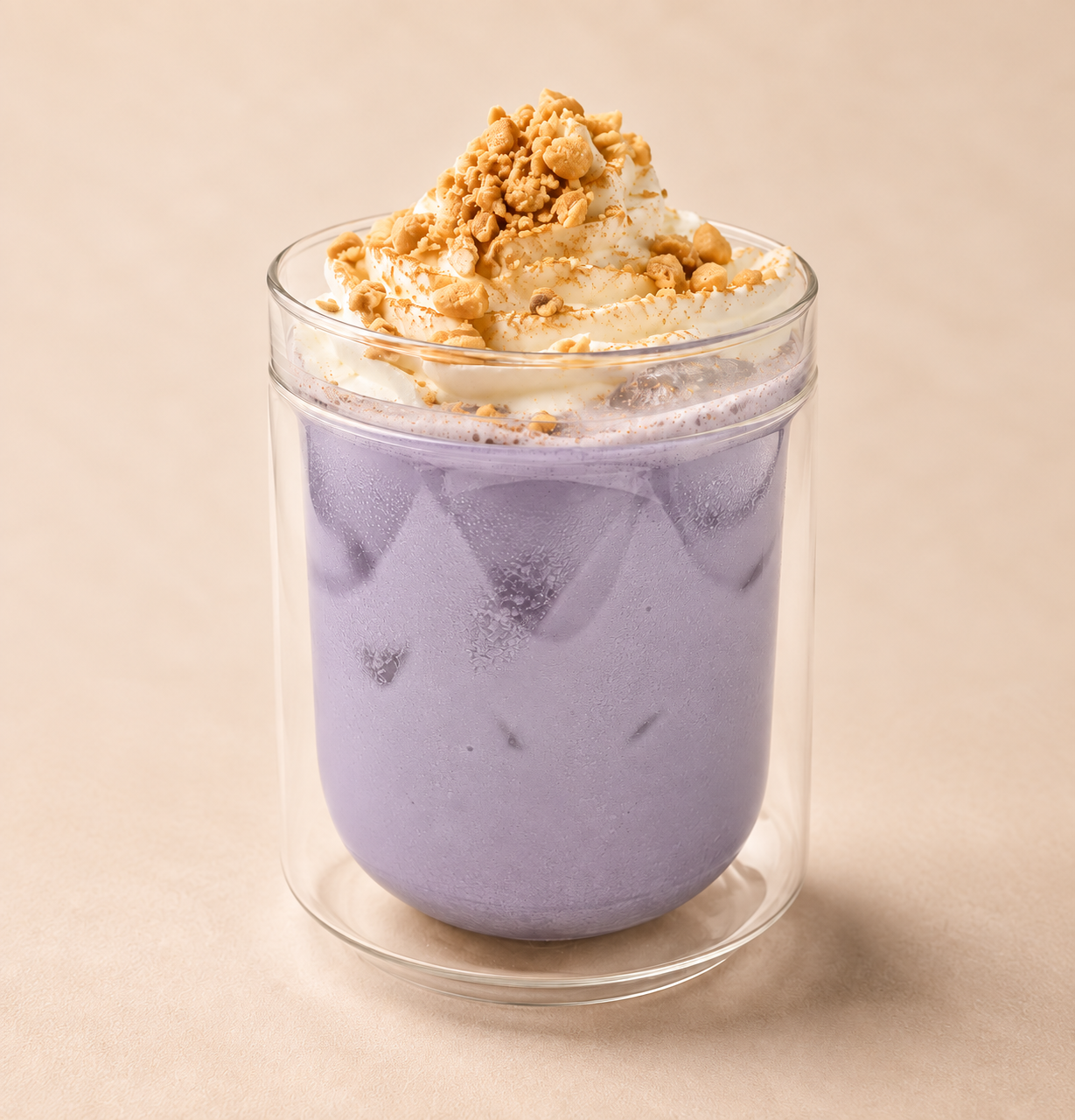 A clear glass filled with UBE HORCHATA