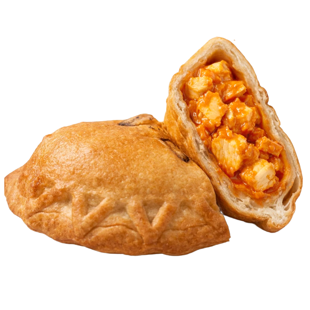 A fried pastry with a golden-brown exterior, cut open to reveal a filling of buffalo chicken