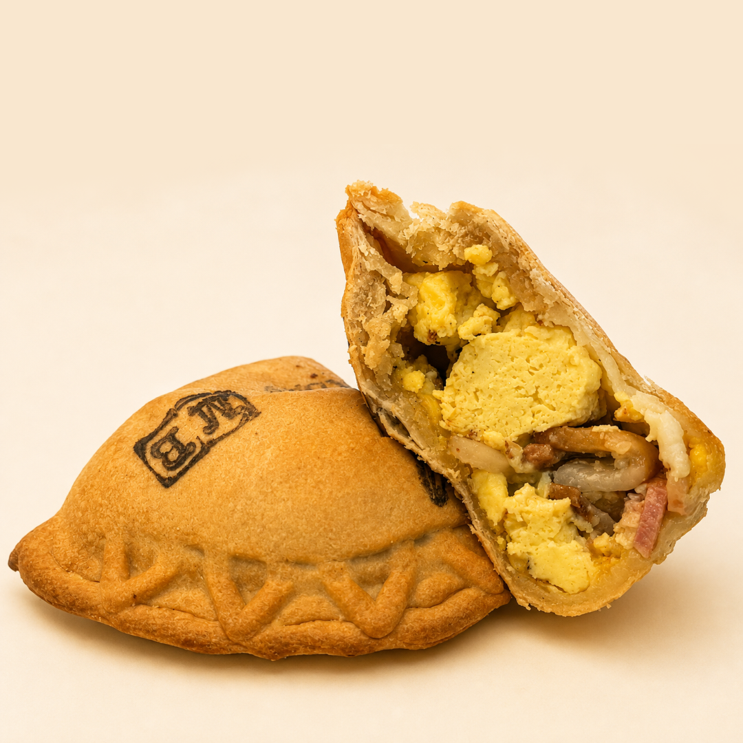Empanada with a filling of cheese, maple syrup infused bacon, and eggs