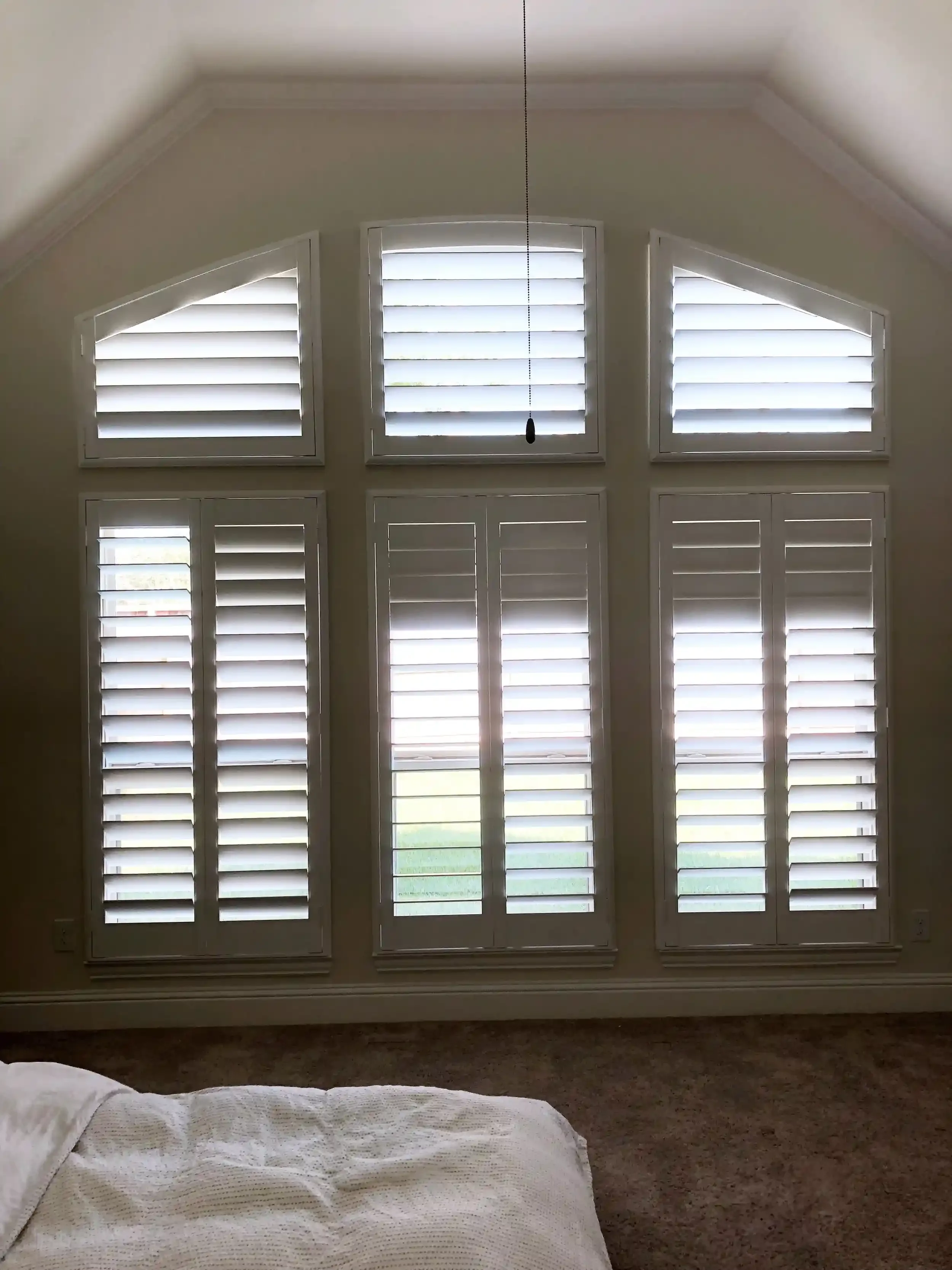 shutters-with-arches-above-the-window.webp