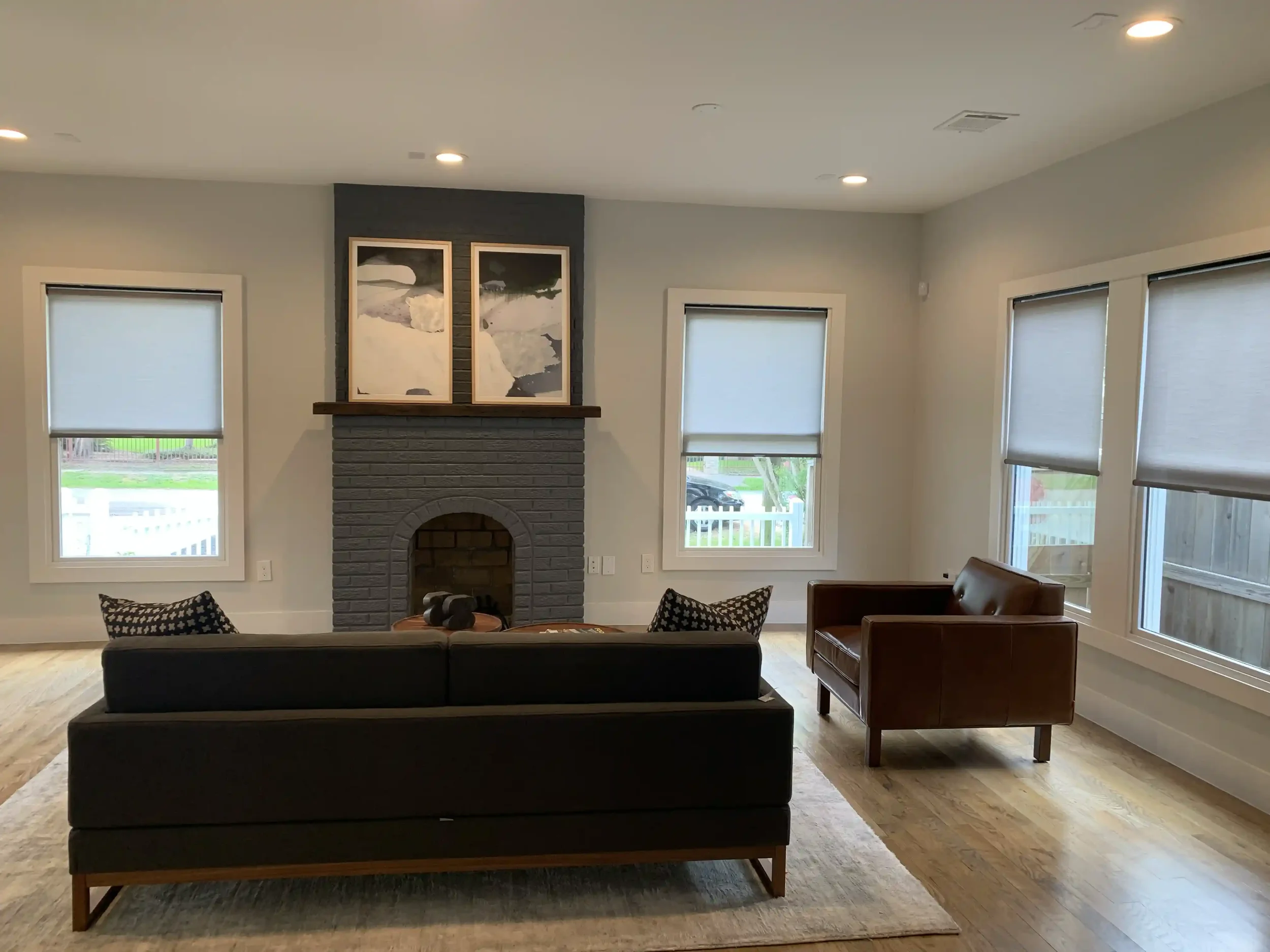 gray-roller-shades-in-living-room.webp