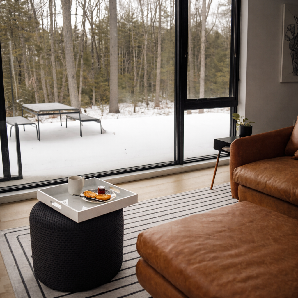 Enjoy a gorgeous view of the forest from the couch through these large windows.