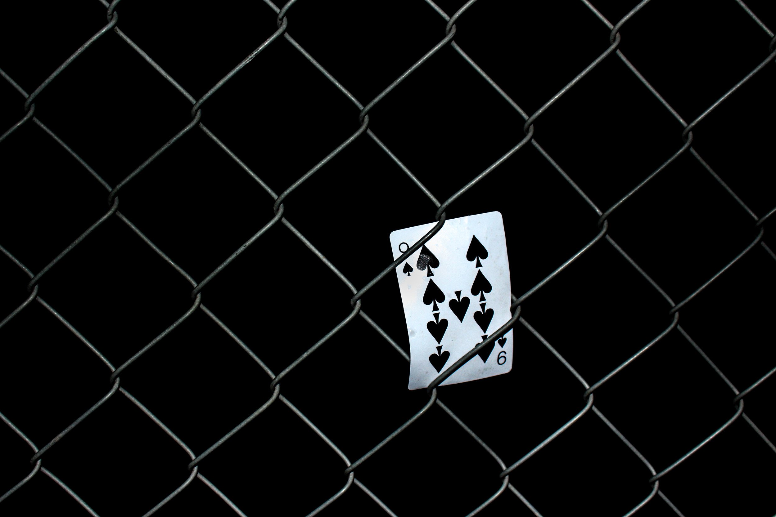 cpr blog post photo - 9 of spades card stuck in fence.jpeg