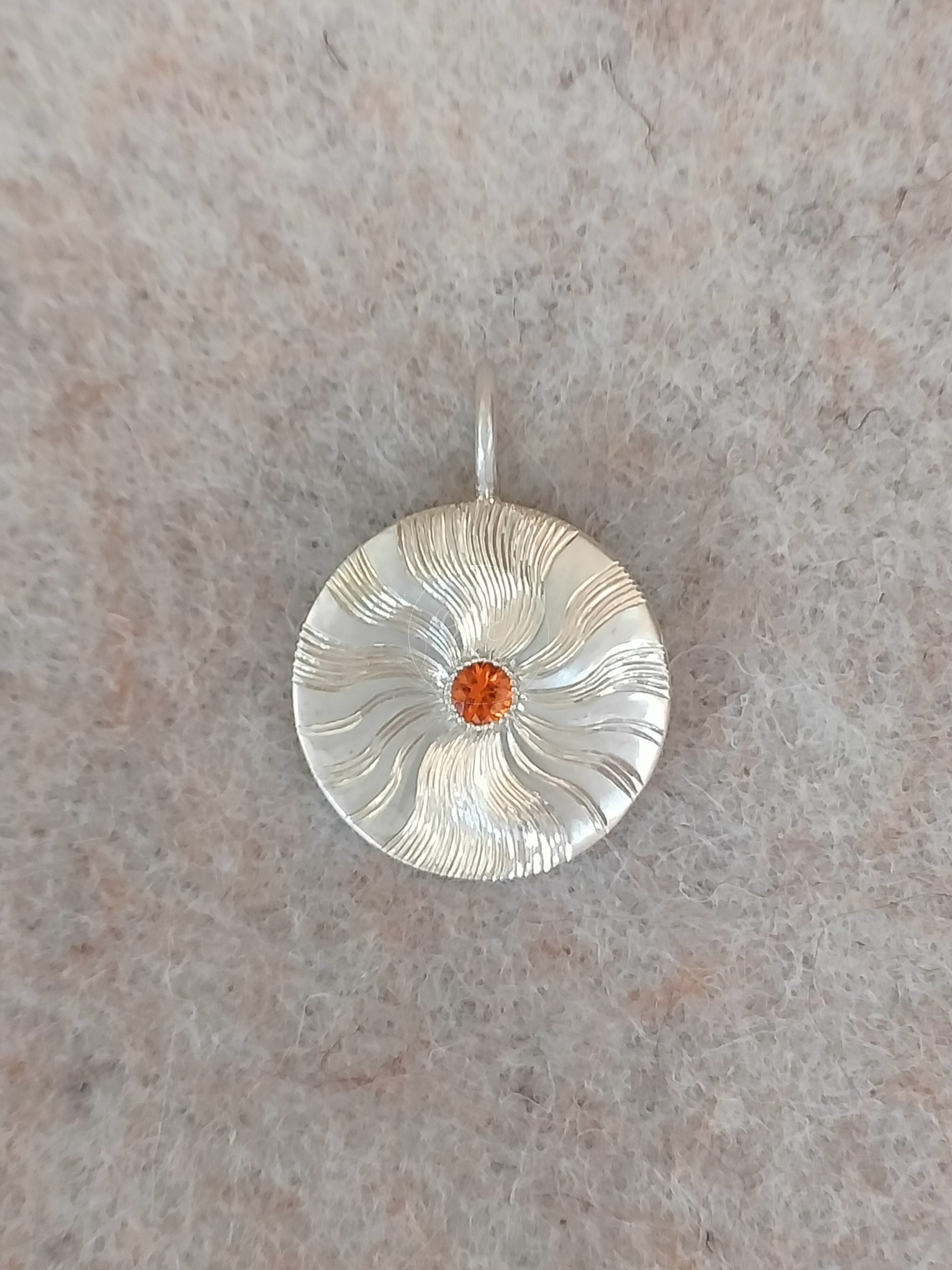 shine like the sun with this silver pendant made by OrfaHandEngraving