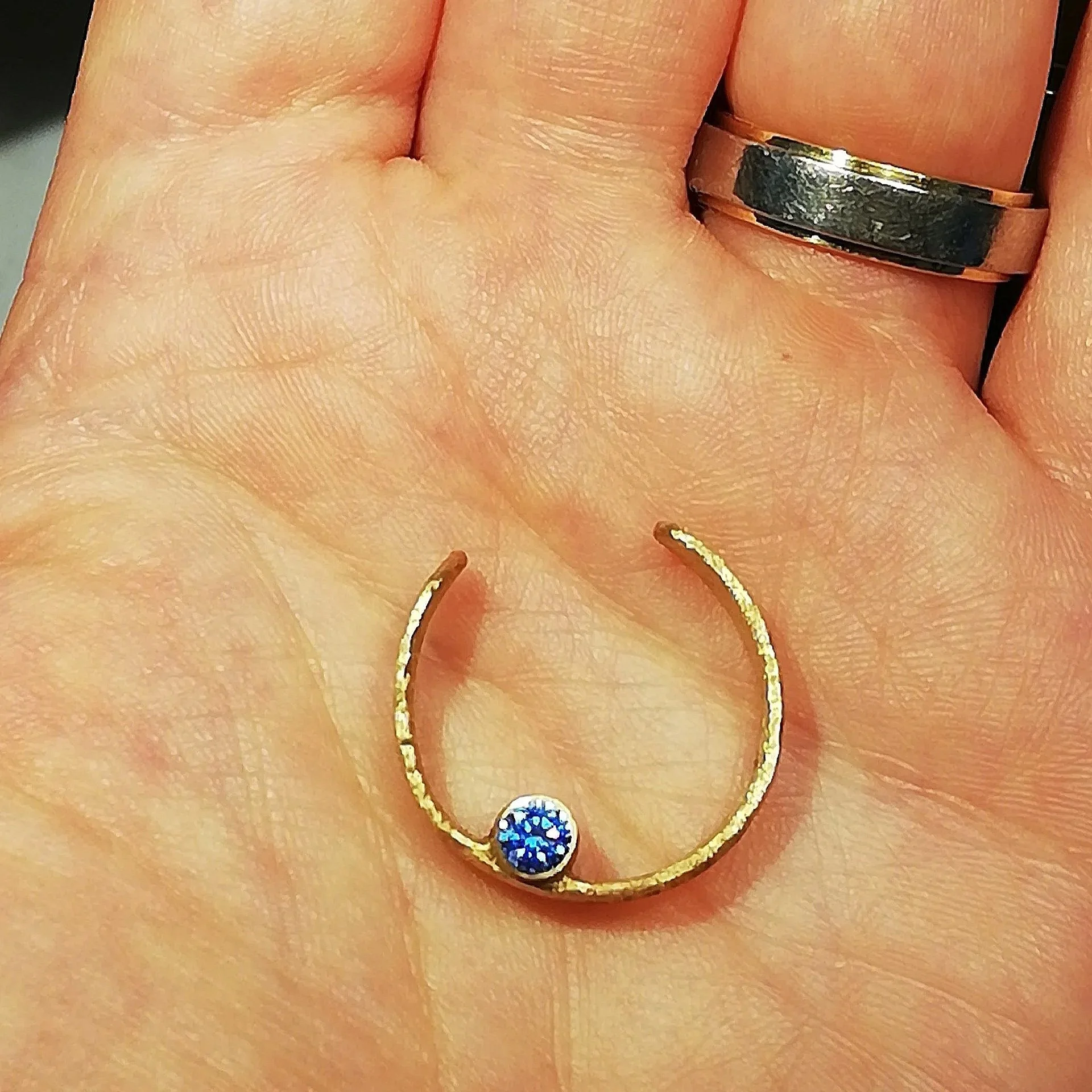 gold pendant in my hand